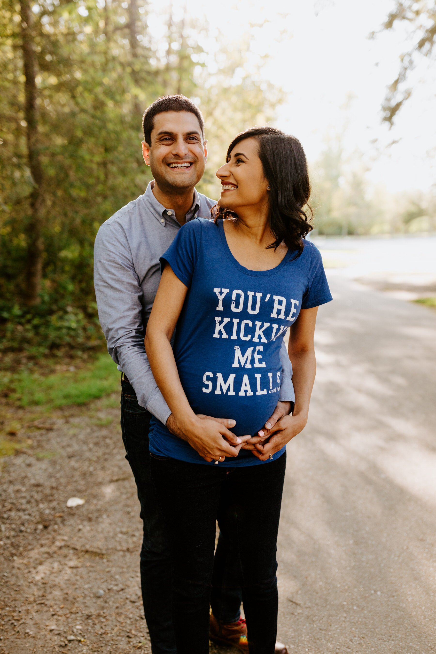 You’re Kickin Me Smalls Pregnancy Shirt | Seattle Maternity Photos | Outdoor forest golden hour maternity session at Lake Wilderness Park in Maple Valley, WA | Tida Svy | www.tidasvy.com