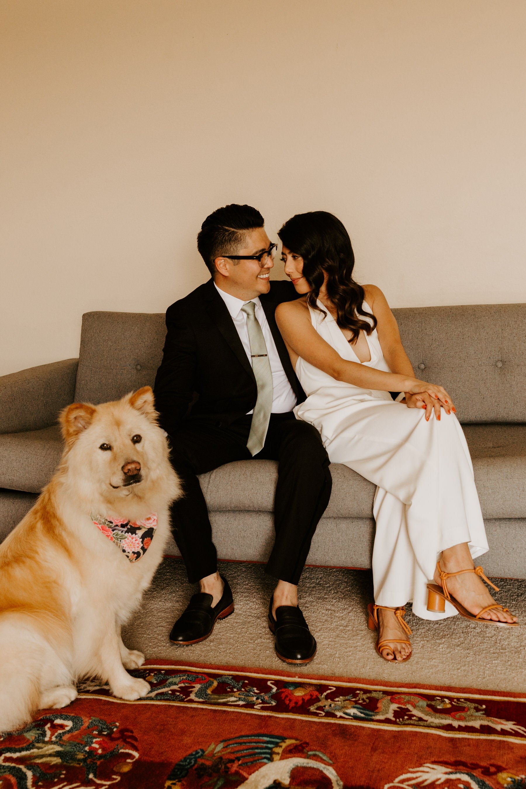 Bride and Groom photo with Dog on Couch | Photo by Tida Svy | www.tidasvy.com | Los Angeles Wedding Photographer
