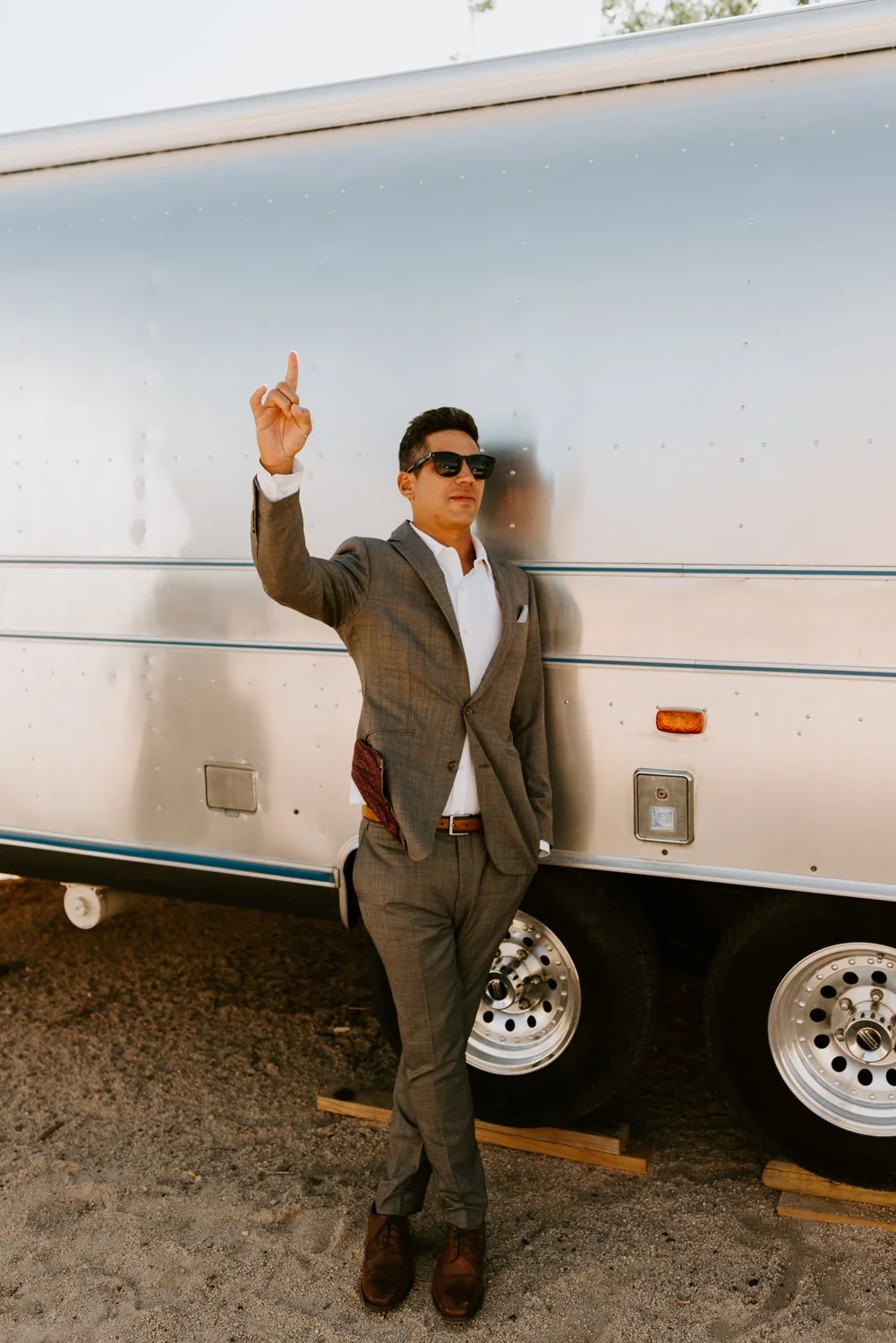 Groom portrait airstream | Le Haut Desert Aerie Wedding | Joshua Tree Wedding Photographer | Tida Svy | www.tidasvy.com
