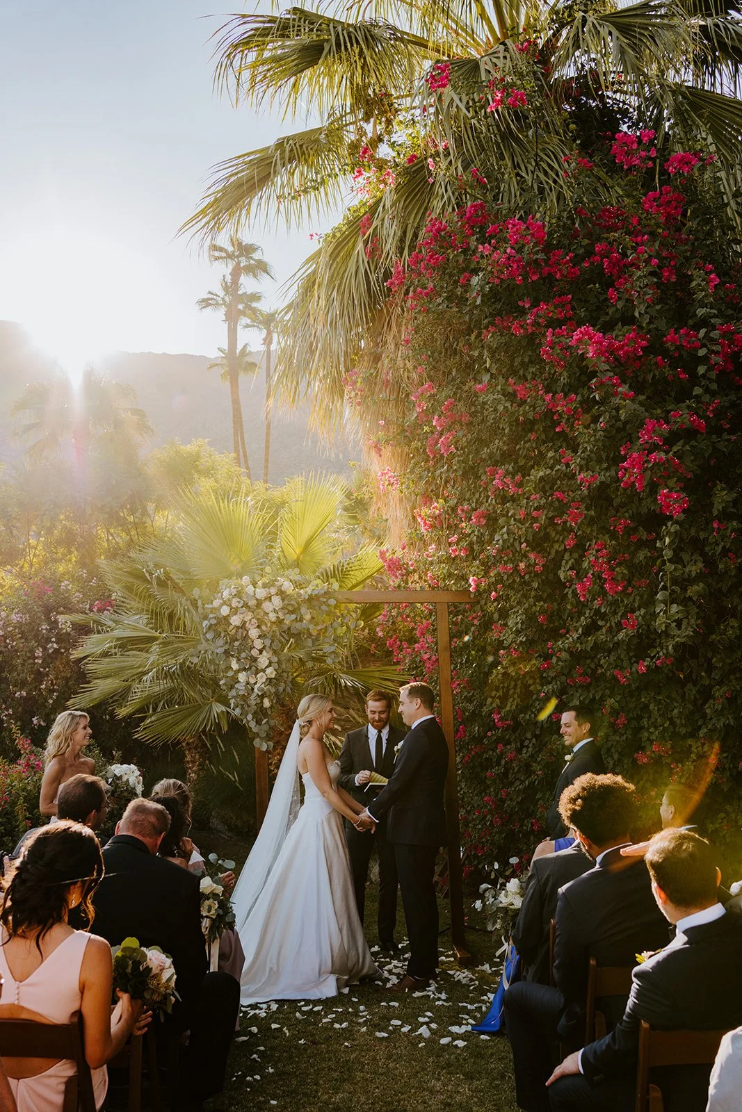 Wedding ceremony during golden hour sunset at The O'Donnell House Palm Springs photographed by Tida Svy