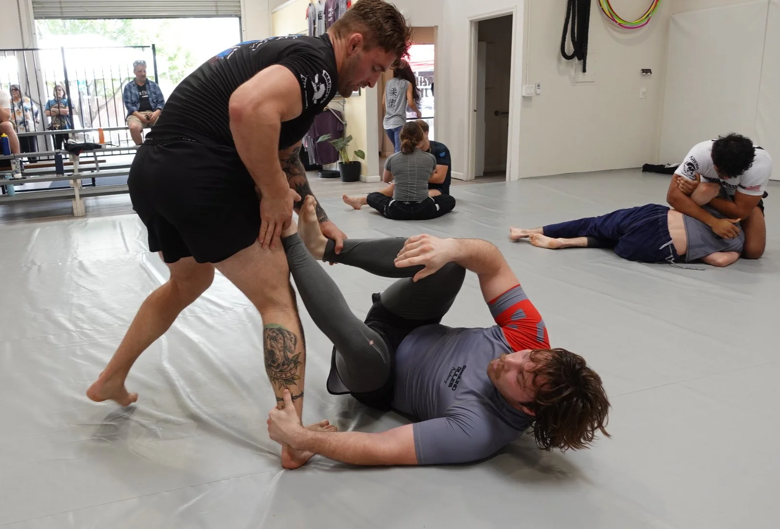 Students training at the Ground Rules Academy Jiu Jitsu Promotion Ceremony Open Mat