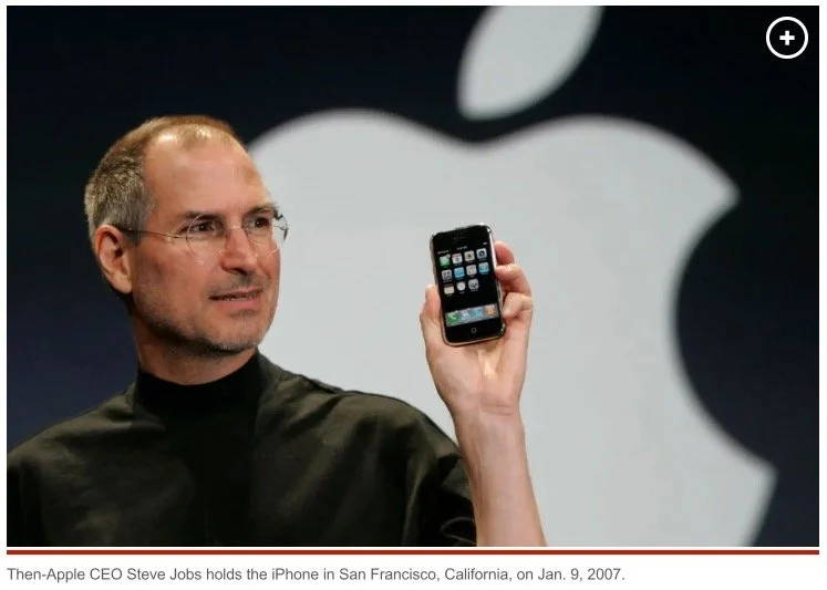 Then-Apple CEO Steve Jobs holds the iPhone in San Francisco, California, on Jan. 9, 2007. AP