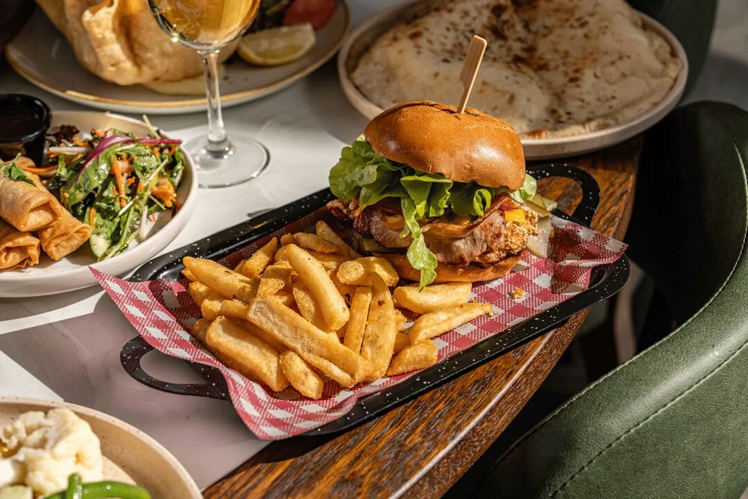 Gourmet burger and fries at The Mill Hotel Milperra