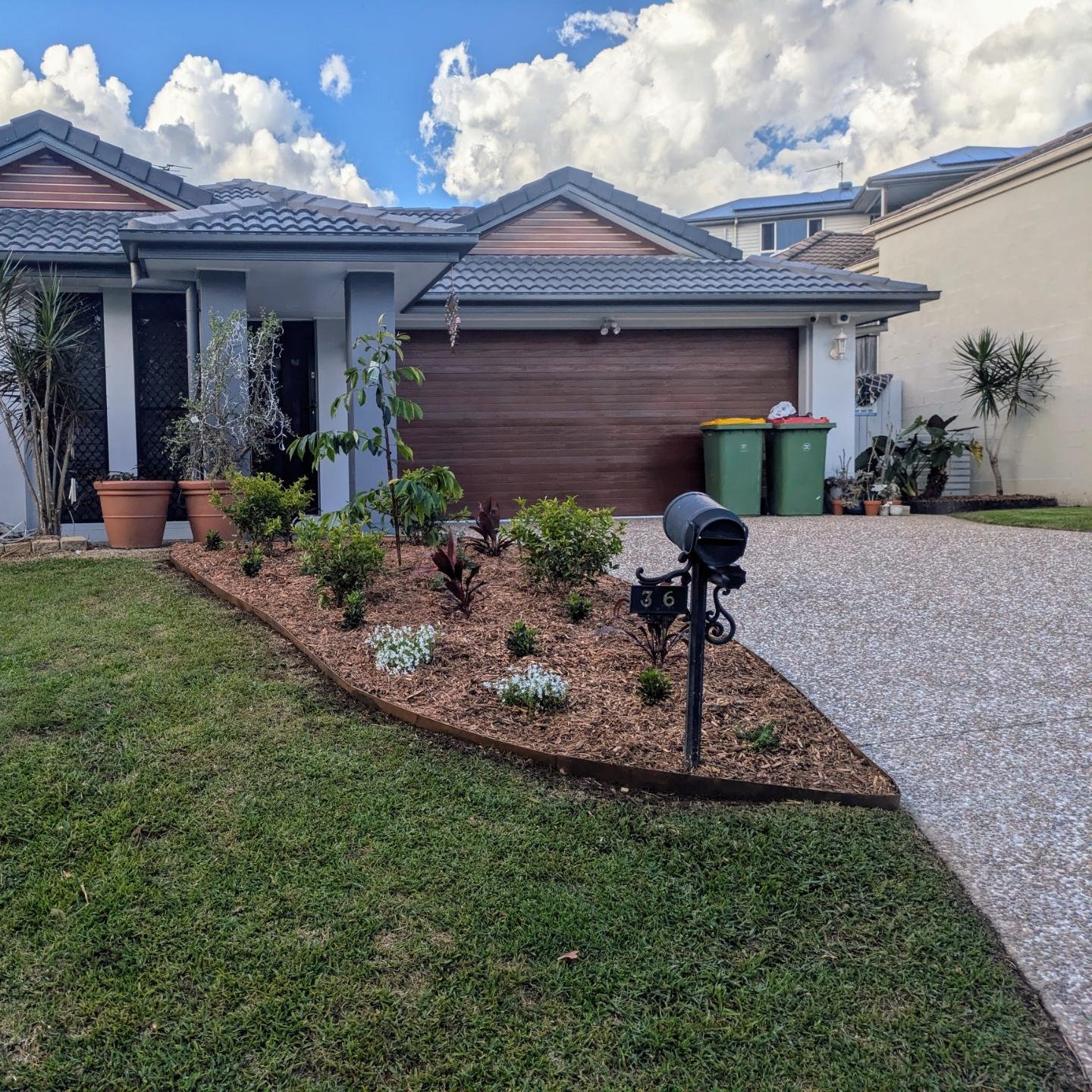 Total transformation before this house hits the market. New weathered steel edging, fresh cypress mulch and a selection of plants to bring colour, ground cover and structure to the front garden. Big push to get it done in time for photos but it came 