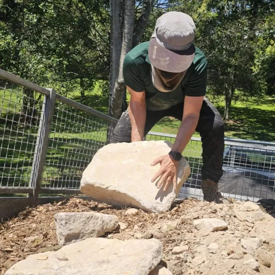 We've been putting in the hard yards moving sandstone boulders into place for some lovely garden edging for clients in Bardon. 

Due to access restrictions, we've moved nearly 10 ton of material by hand! Slow but necessary work to get everything look
