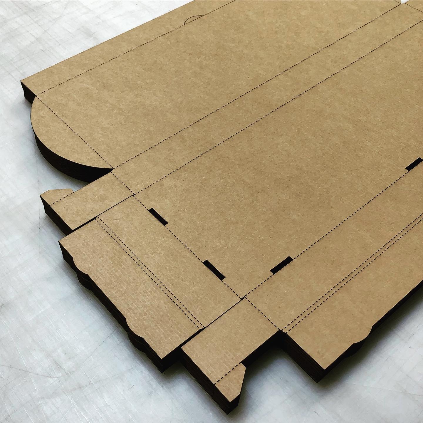 Custom packaging for a neighboring woodworking shop. #lasercutting #corrugatedboxes #ButcherBlock #Walnut #ClaroWalnut #LiveEdge #laserengraving