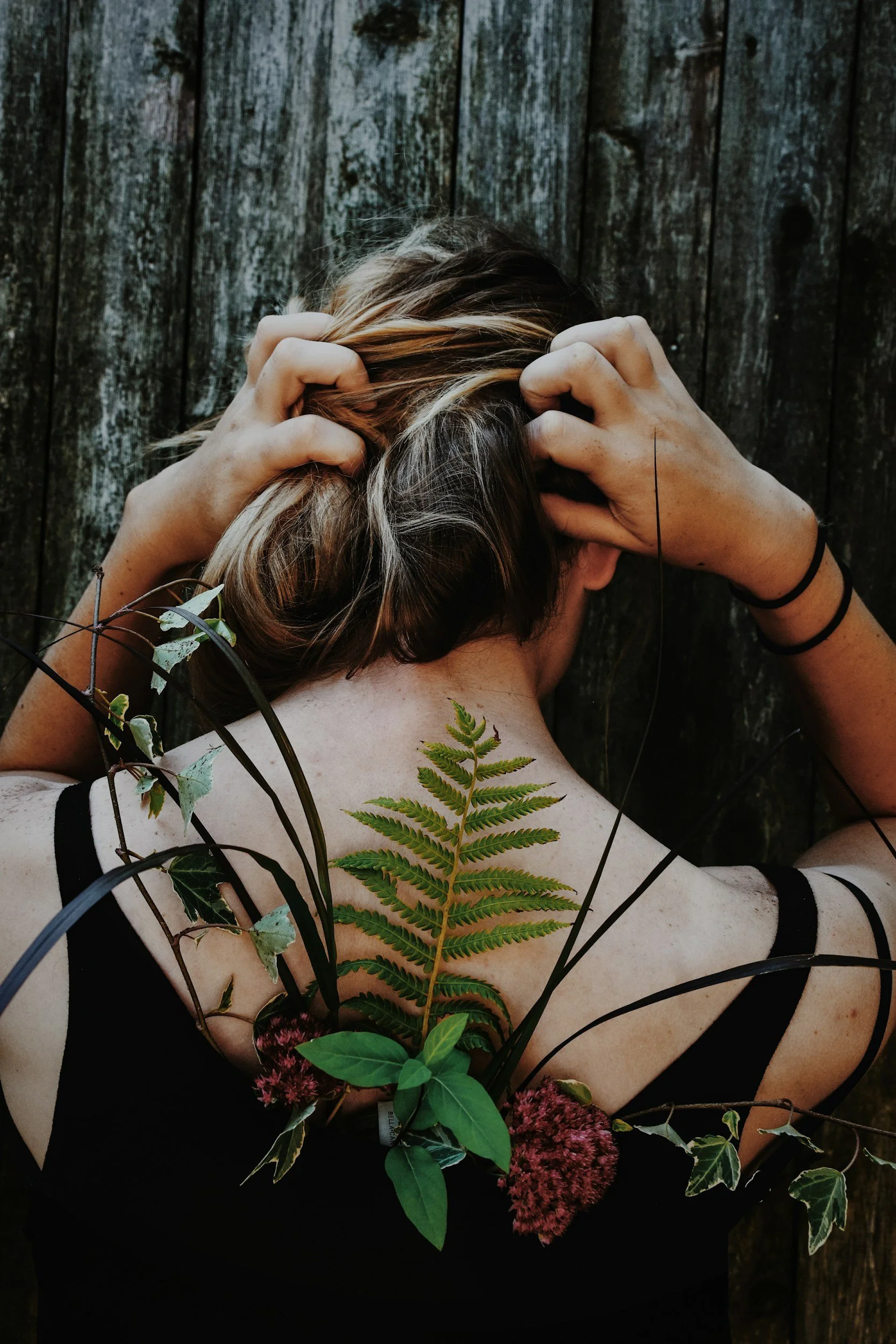 Female Naturopath with bunch of herbs