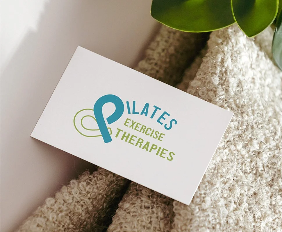 Blue green logo design Pilates Exercise Therapies on a business card