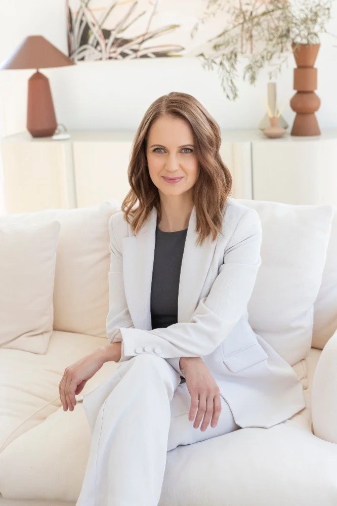 Photo of Nicole Odlum sitting on sofa.jpg