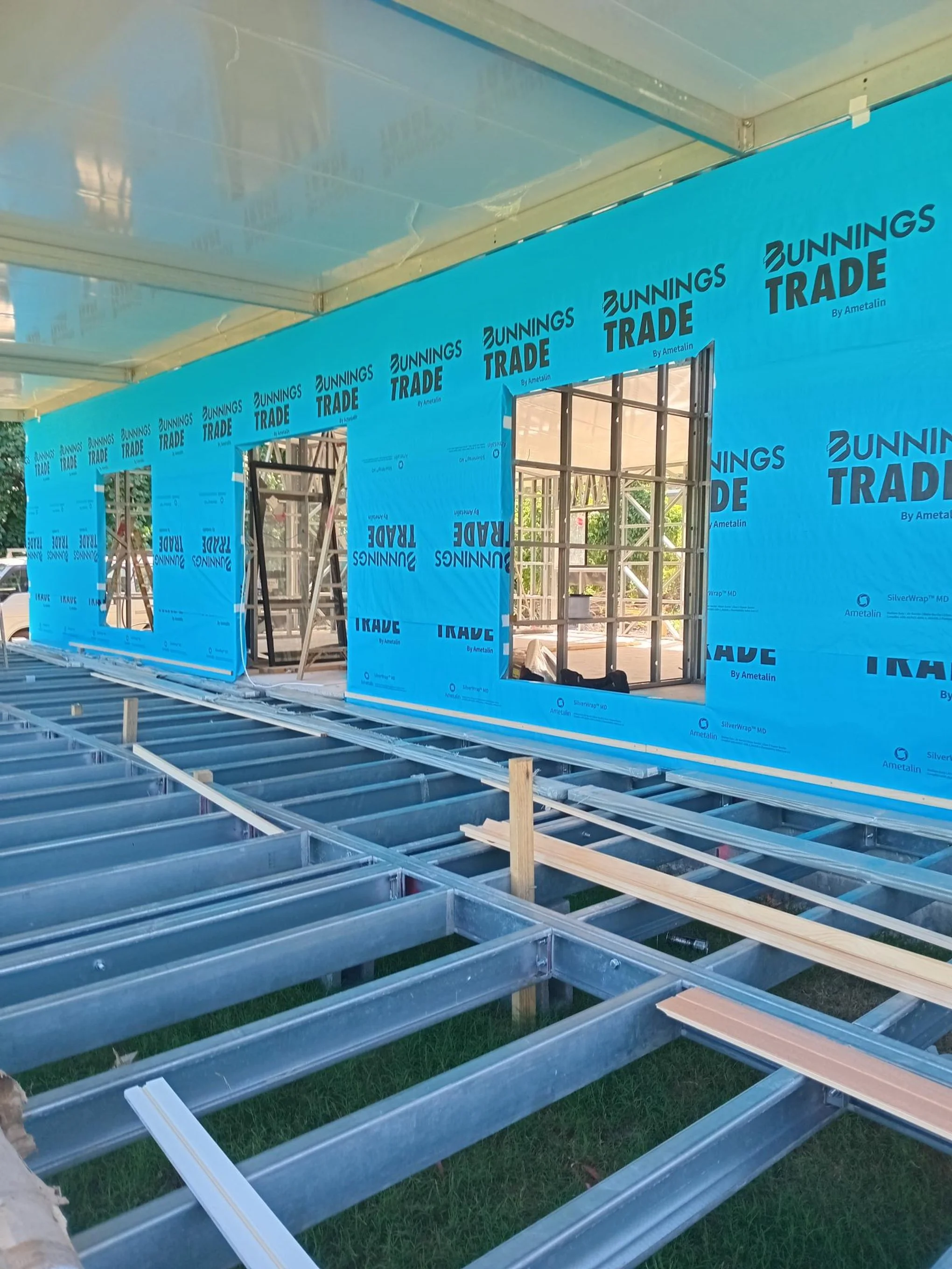 Windows and doors going into this huge kit home.jpg