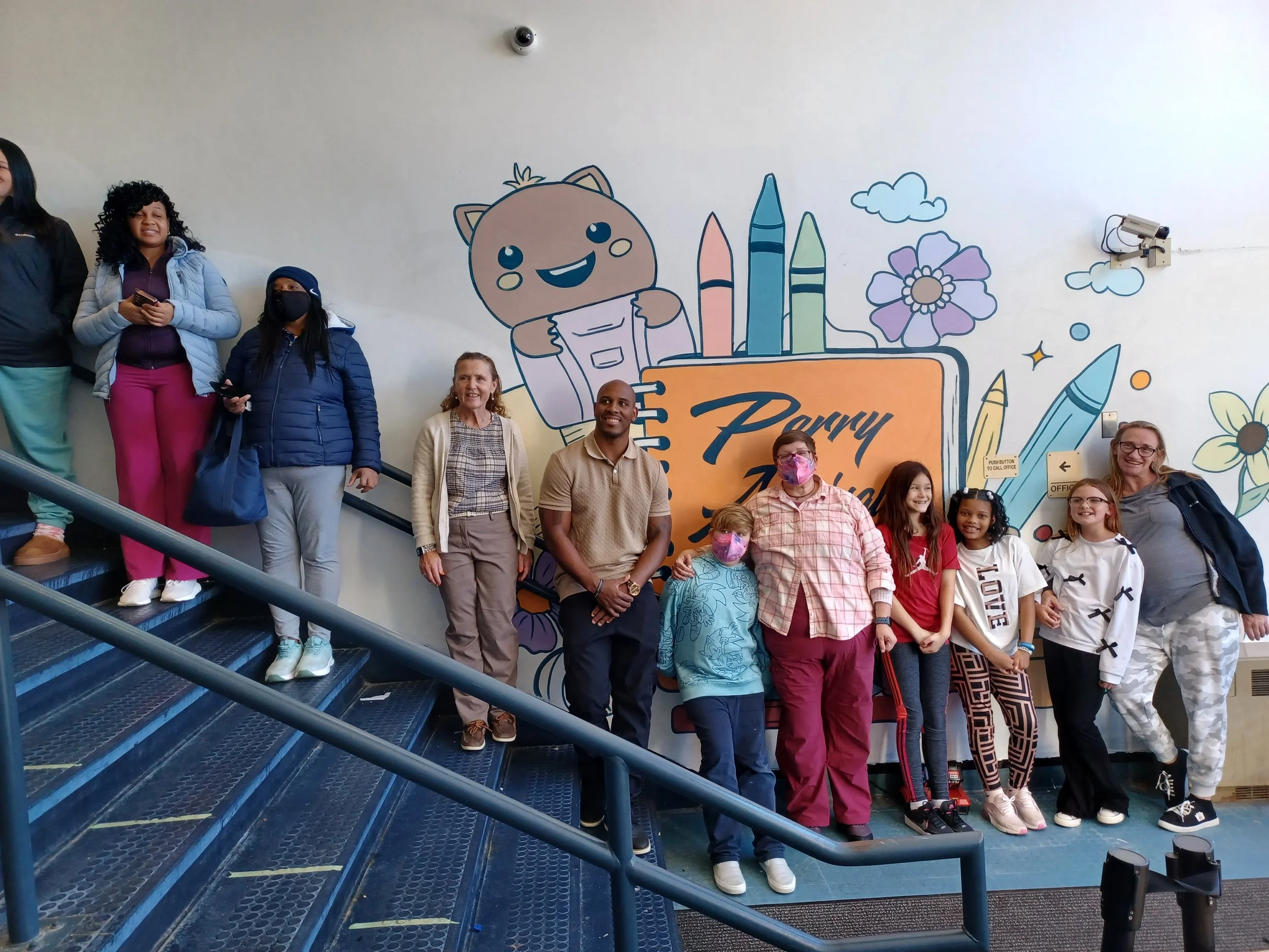  At Perry Elementary, teaching artist Ceasar Westbrook worked with students in the after school program to design and create a vibrant mural inside the school’s Cascade Street entrance.&nbsp; 