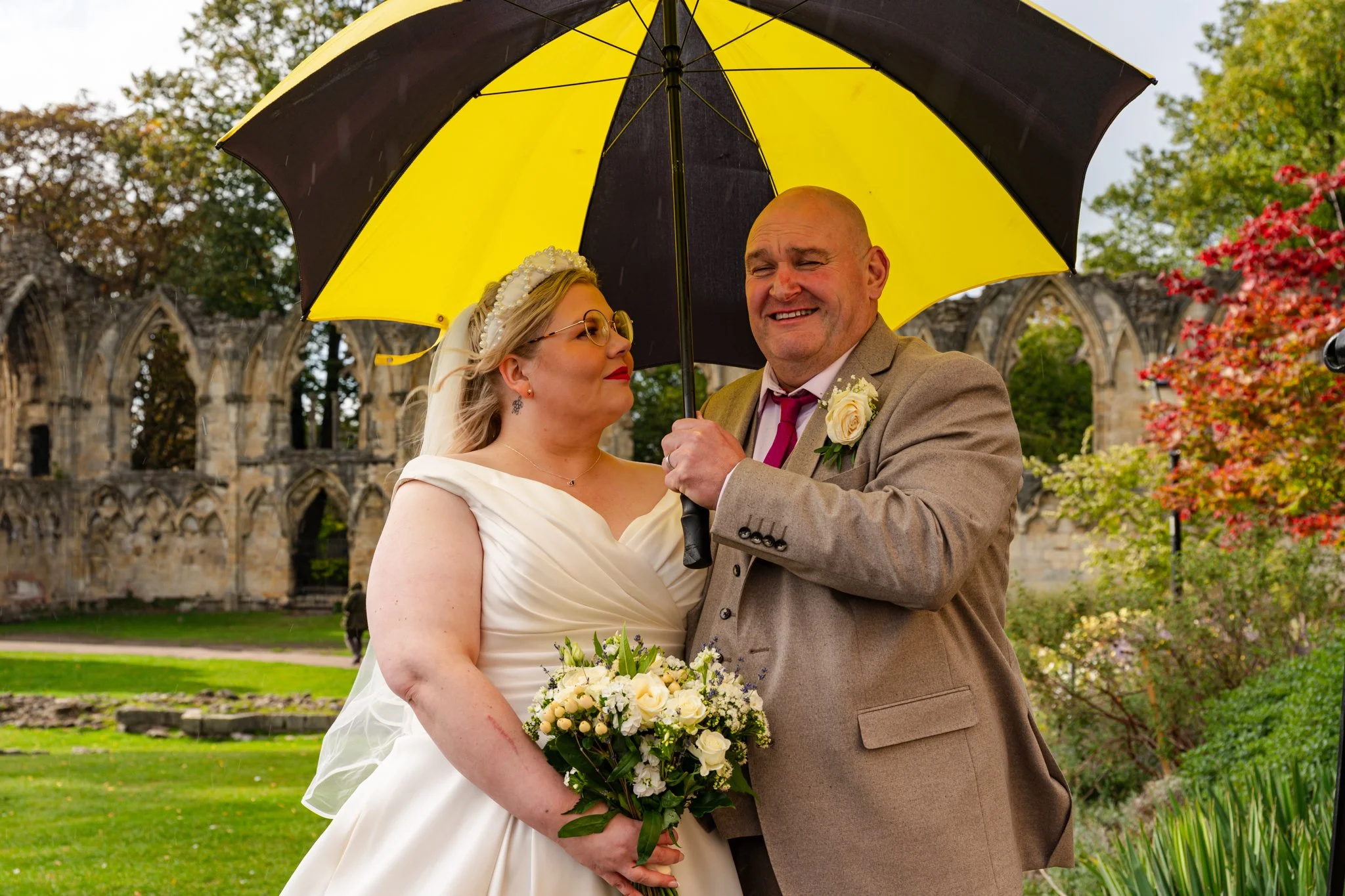 Bride and Groom under an umbrella