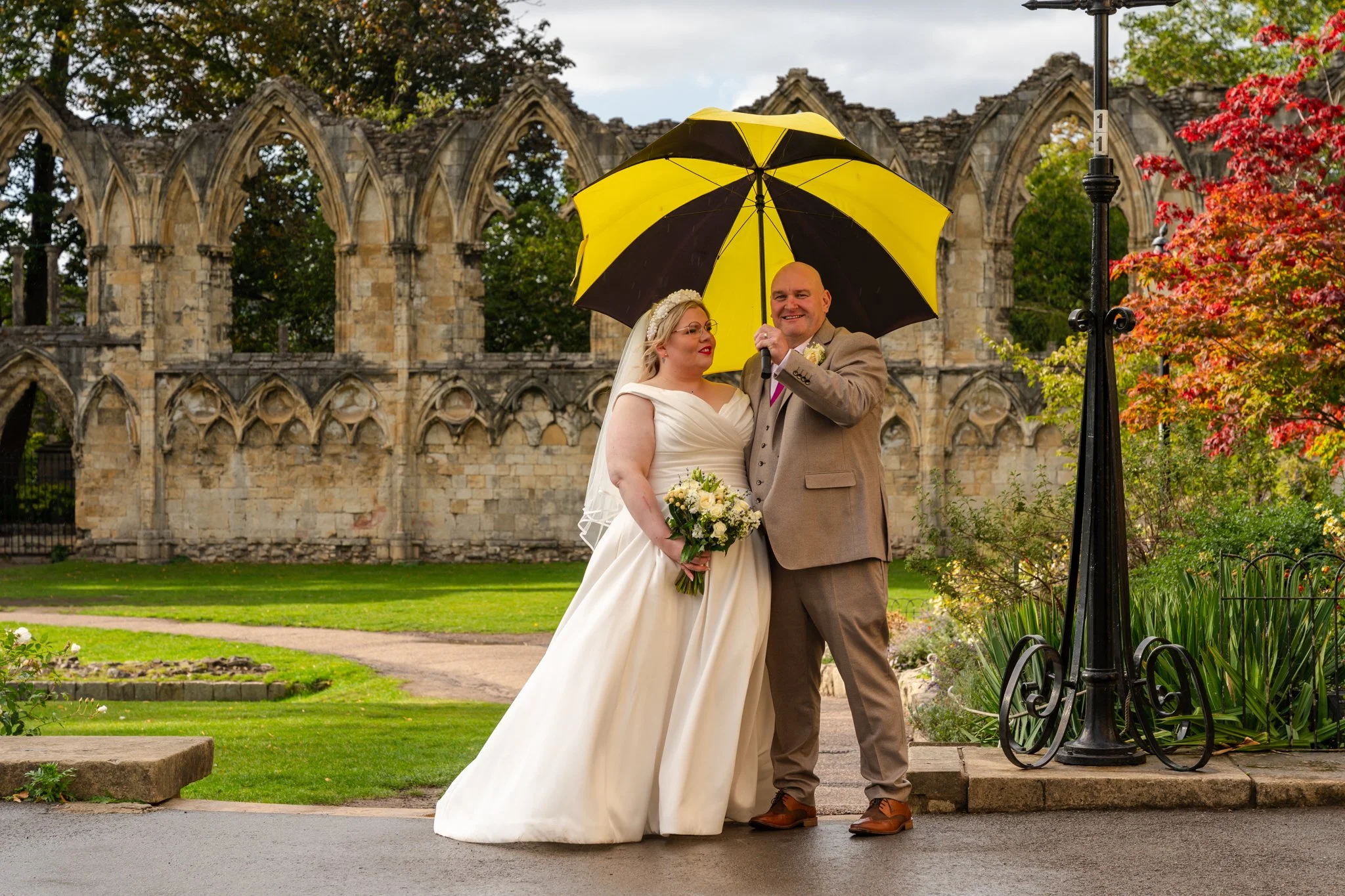 Bride and Groom dealing with the rain