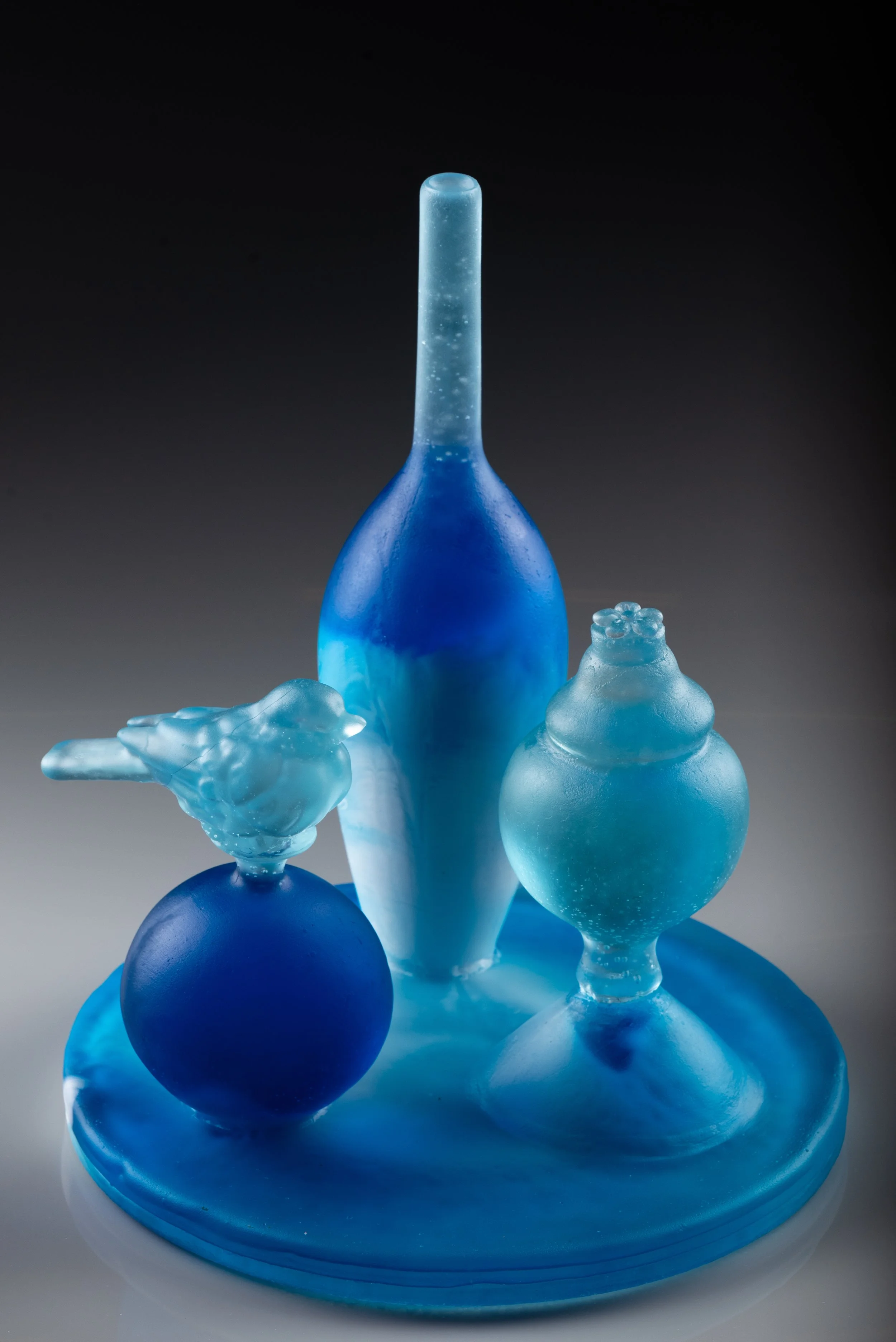 Blue piece grey background copy.jpg
