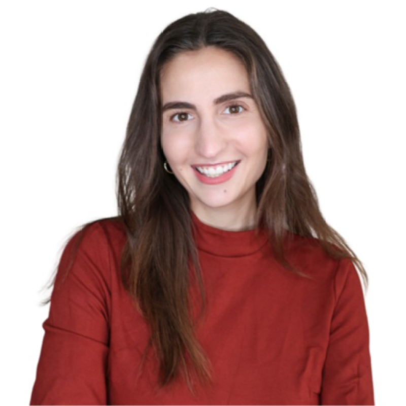 Young woman with long brown hair, smiling, wearing a red top, against a white background.