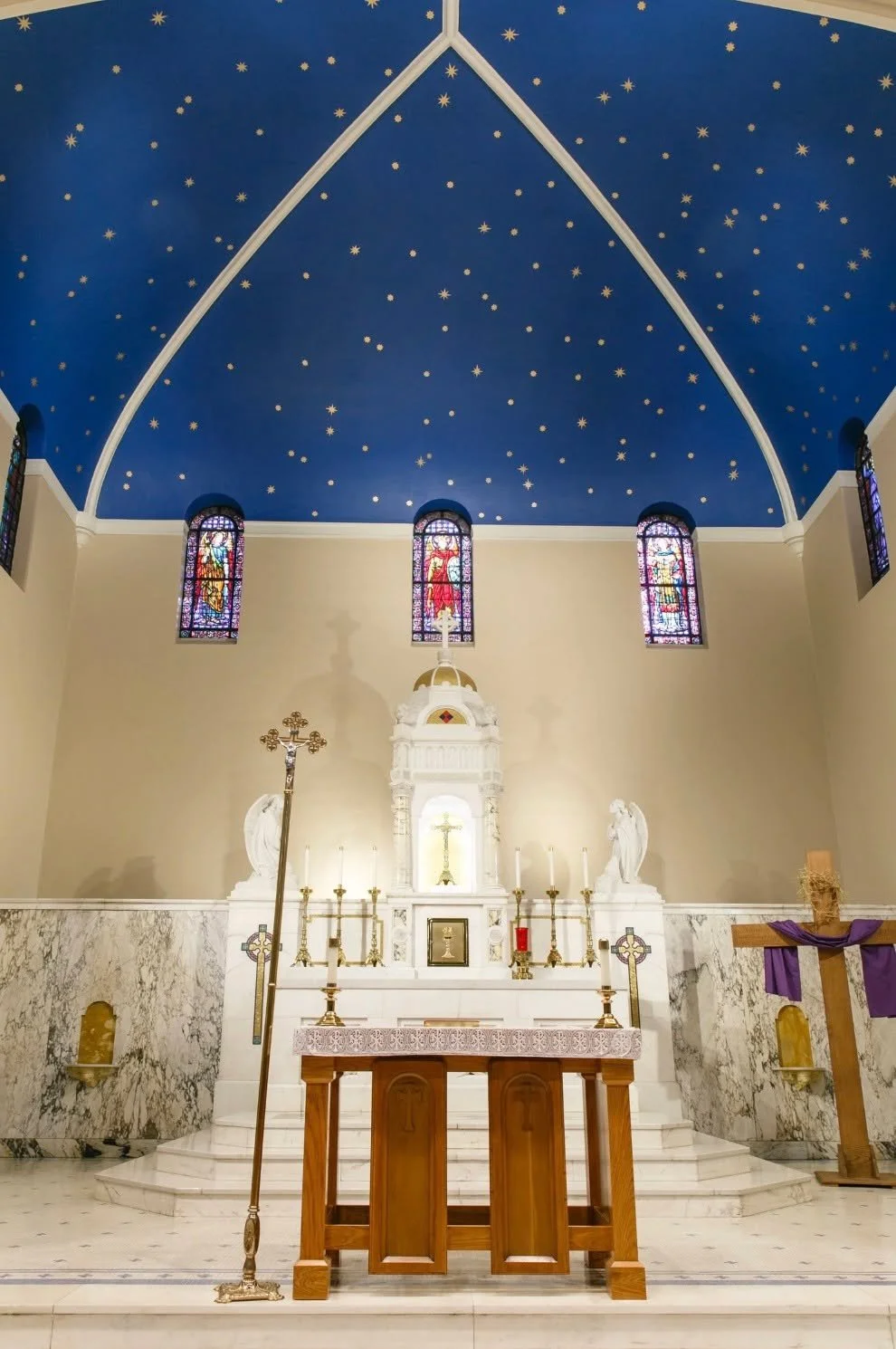 Our team painted the walls, ceilings, and trim, meticulously created a faux marble finish on the columns, and hand-painted gold stars across the ceiling. Work at this level takes patience, precision, and a highly skilled crew, and these specialty fin