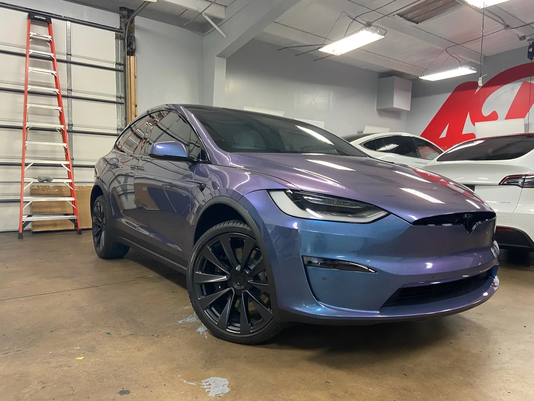 iridescent purple wrapped Tesla Model Y