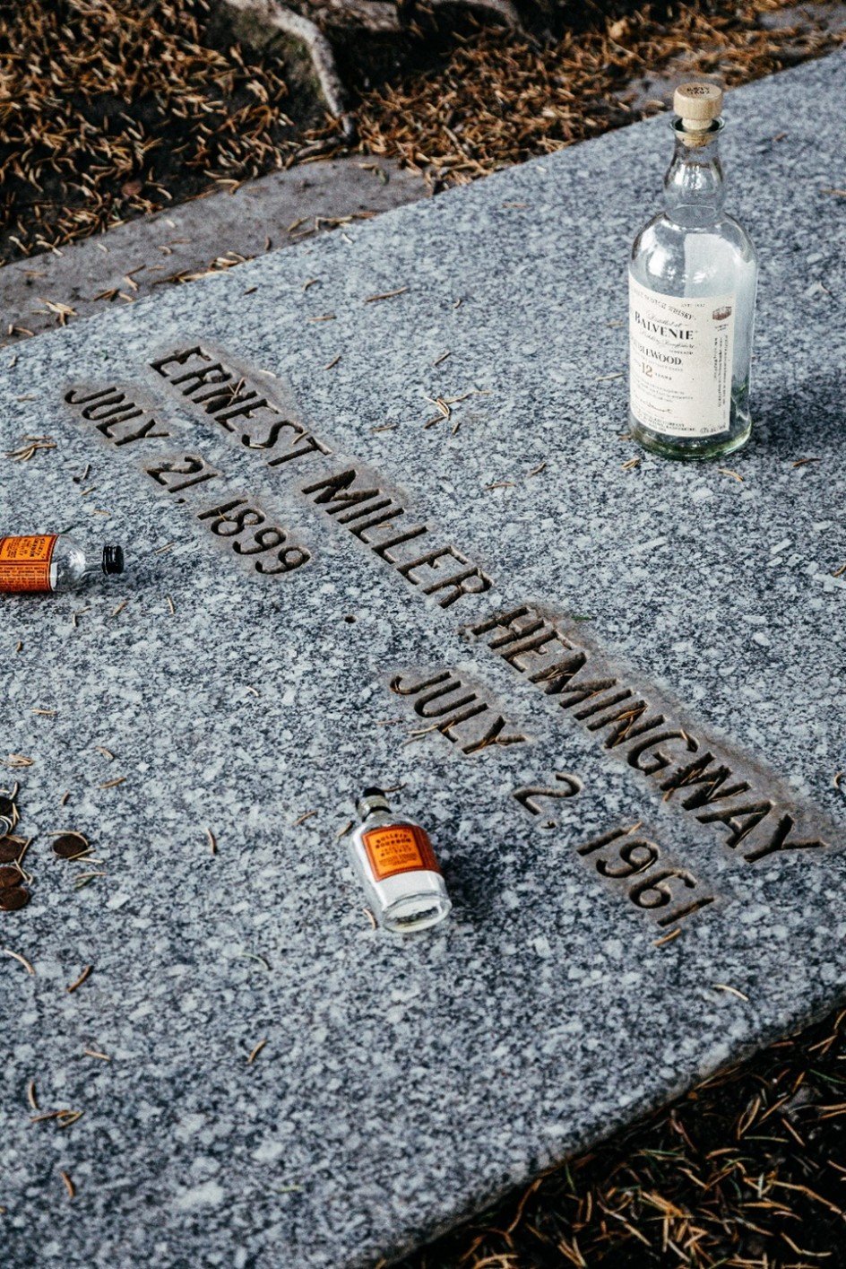 PART V - Hemingway grave with liquor bottles.jpg
