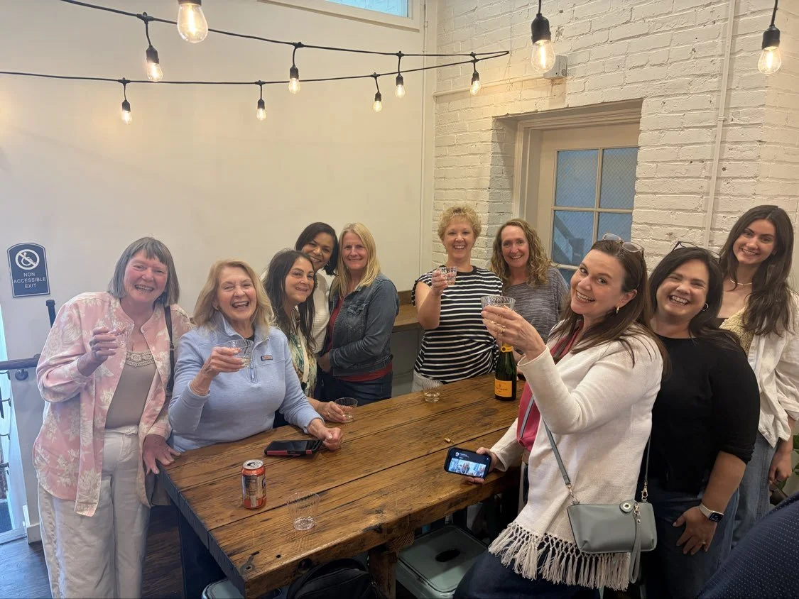 Group of women holding drinks at Chellas on a group walking tour
