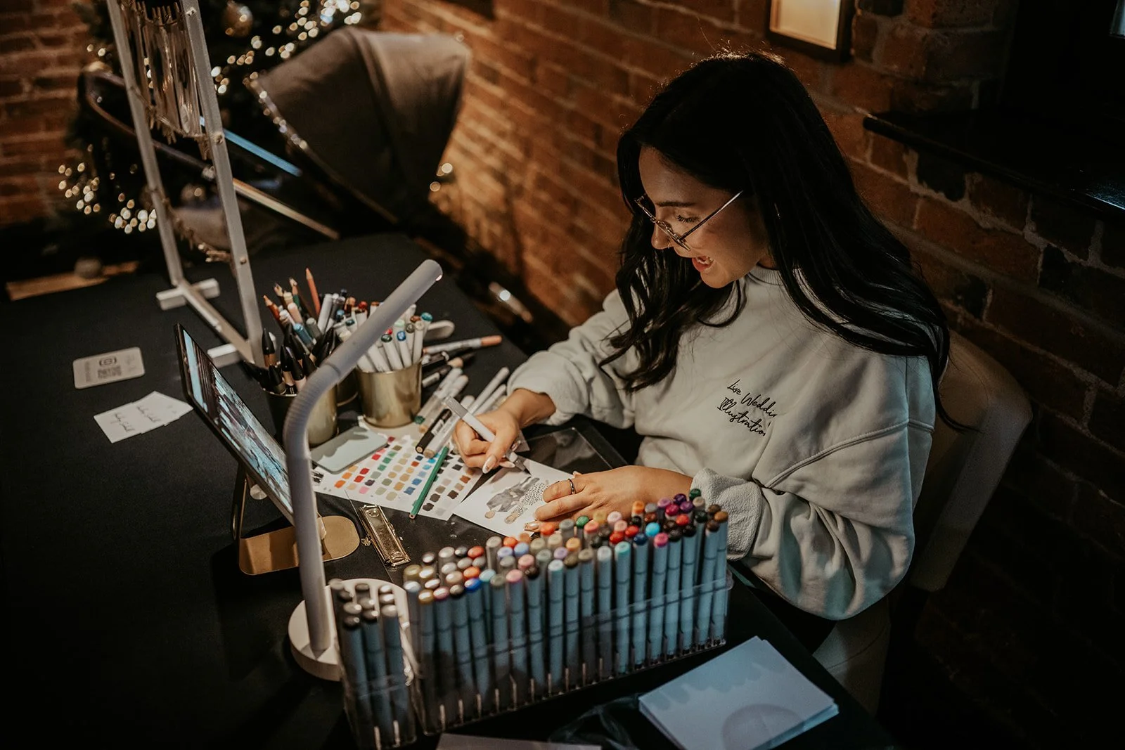 live wedding illustrator drawing guest portraits at Swancar Farm