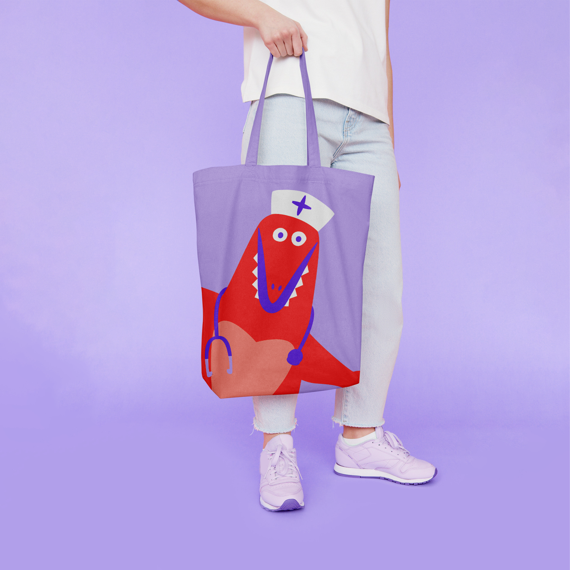 Person holding a purple tote bag with a cute red dinosaur wearing a nurse's hat and stethoscope printed on it.