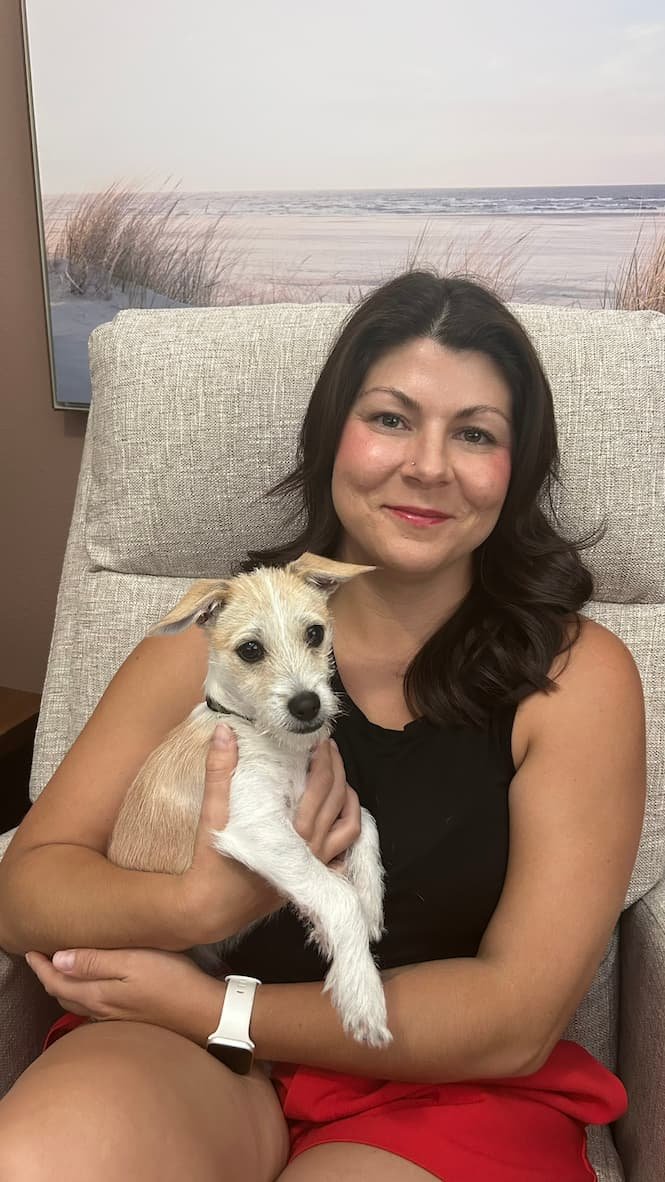 Anxiety and burnout therapist in McKinney, TX with her dog in her office