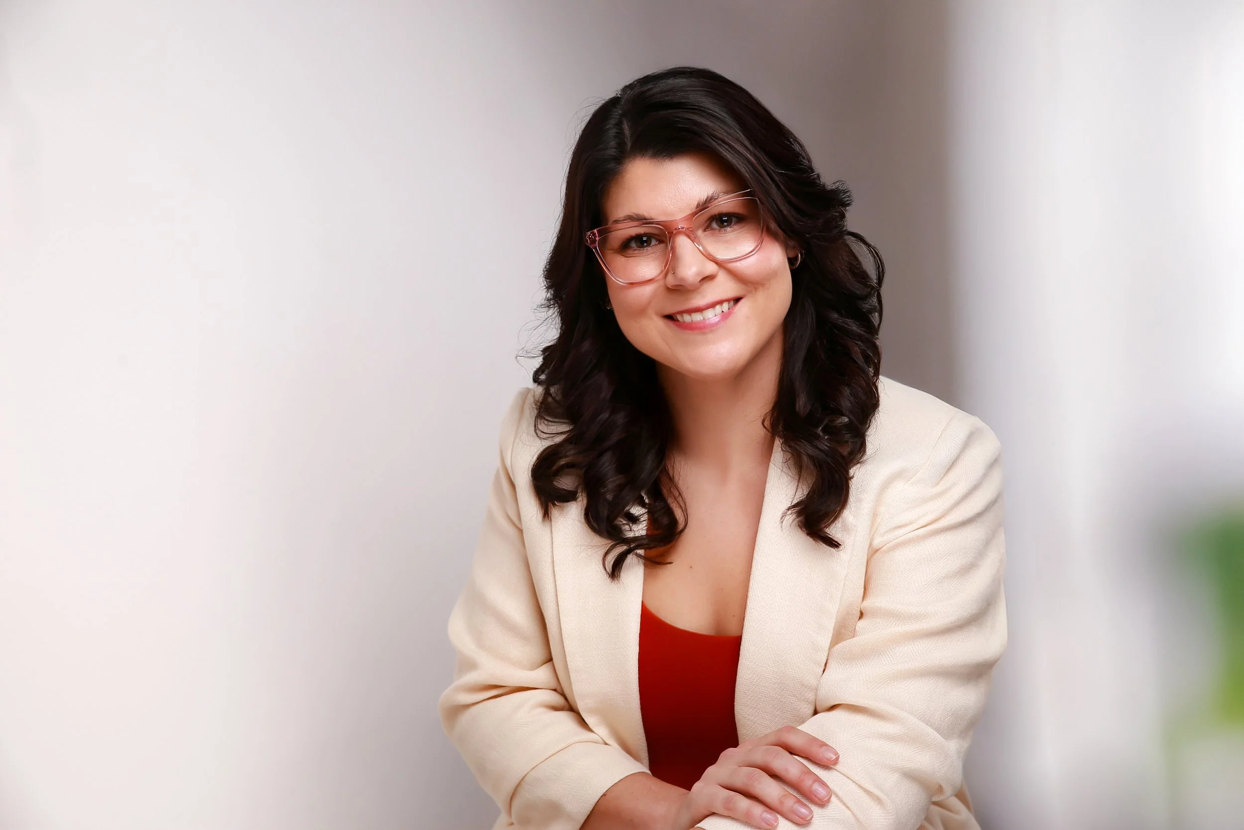 Licensed therapist in McKinney, TX wearing professional clothing and smiling