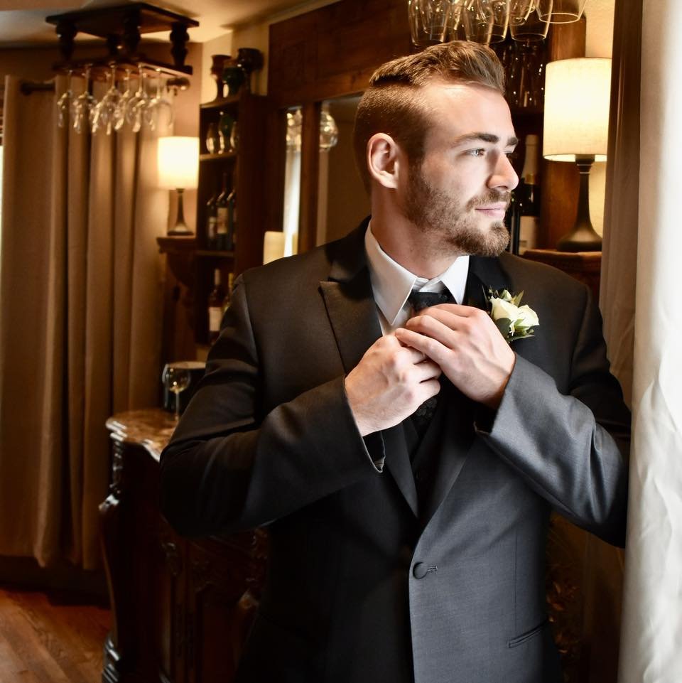 man wearing black tuxedo at a wisconsin venue
