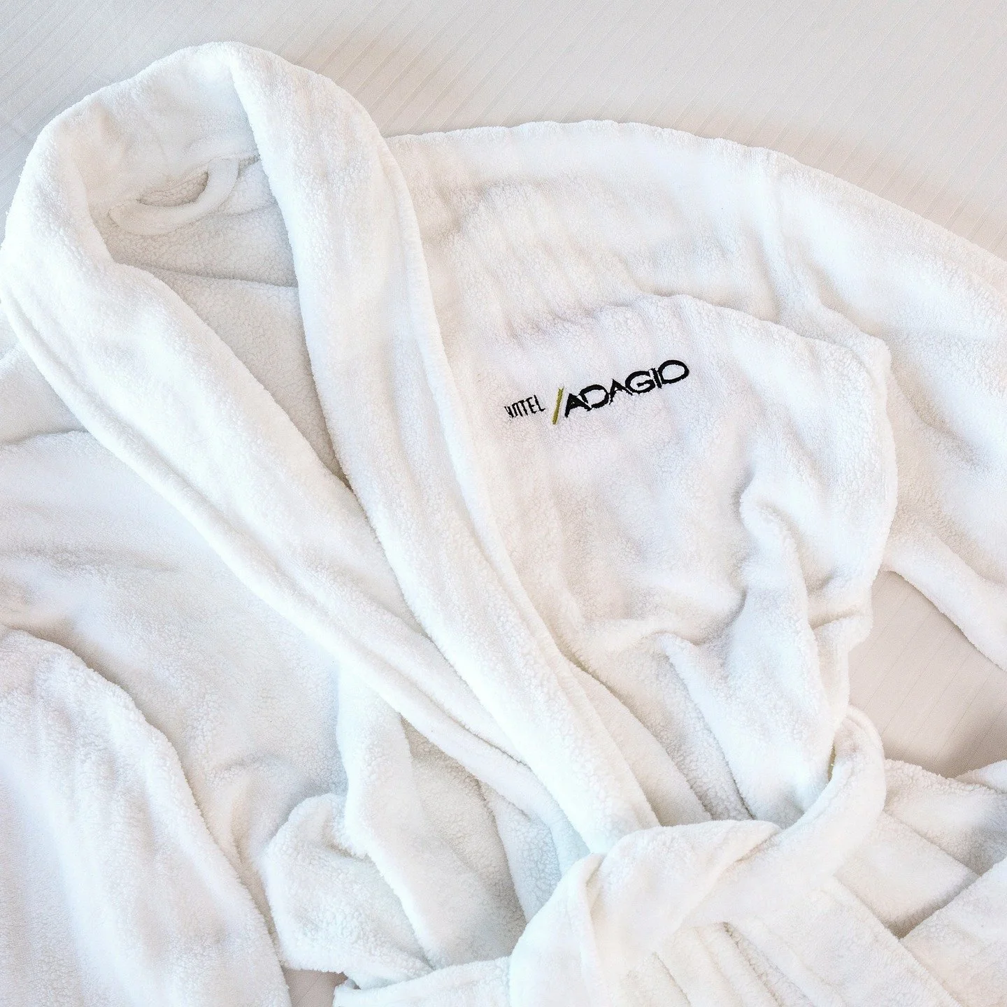 Egyptian cotton linens, plush robes, PURE bath amenities, and a 50-inch screen for when you finally slow down. Rest has an address.
