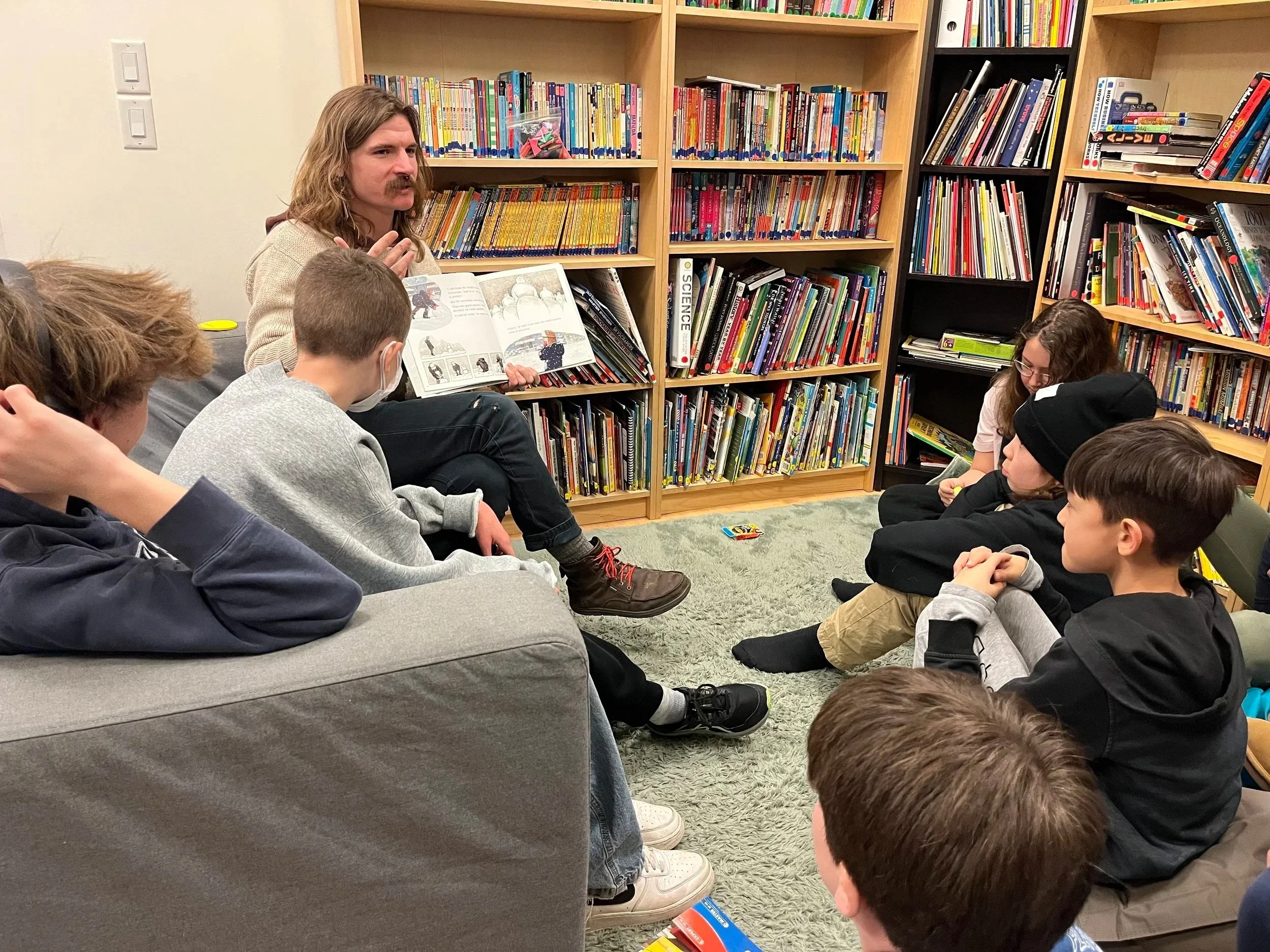 Students engaged in a group discussion that develops critical thinking and communication skills