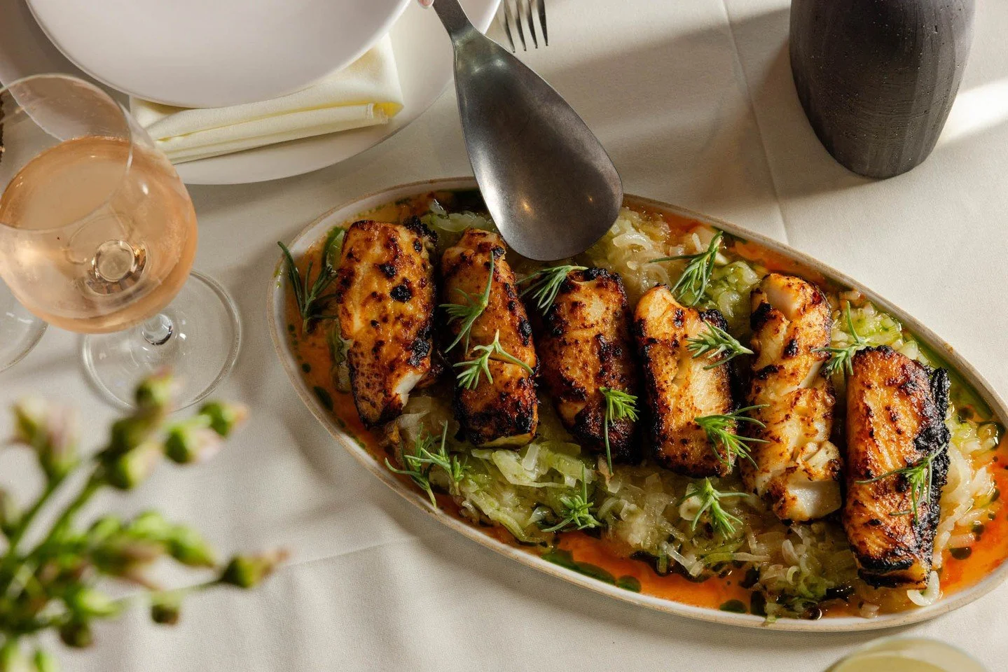 Your menu could shine with silky black cod &mdash; spiced just right with chili oil and brightened by fennel + herbs. A perfect balance on the plate, just like everything Chef Nicole LoBue creates.