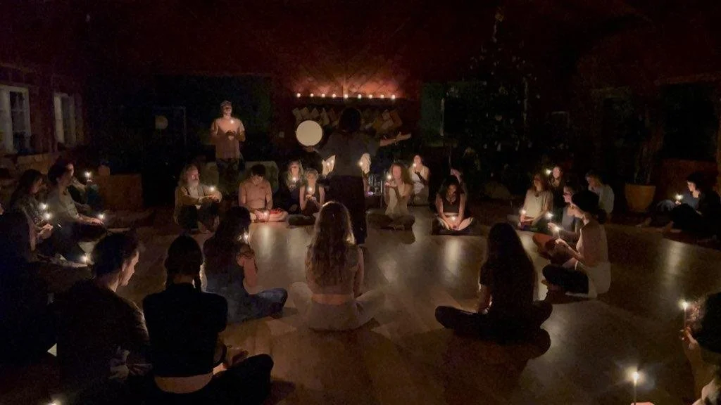 Bringing in the Light — Winter Solstice: a candlelit community circle gathered around song and rhythm.