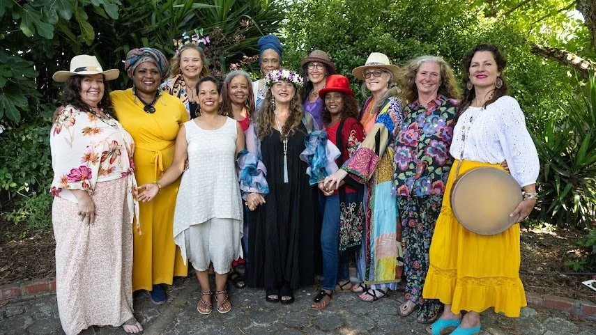 Lavender Grace Kent with participants gathered outdoors for a community gathering.