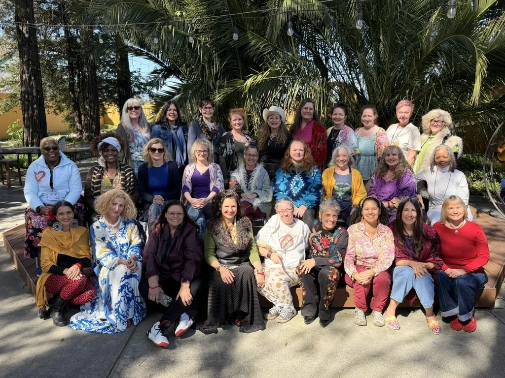 Color of Woman 2026 at the Center for Intentional Creativity: participants gathered for a group portrait outdoors.