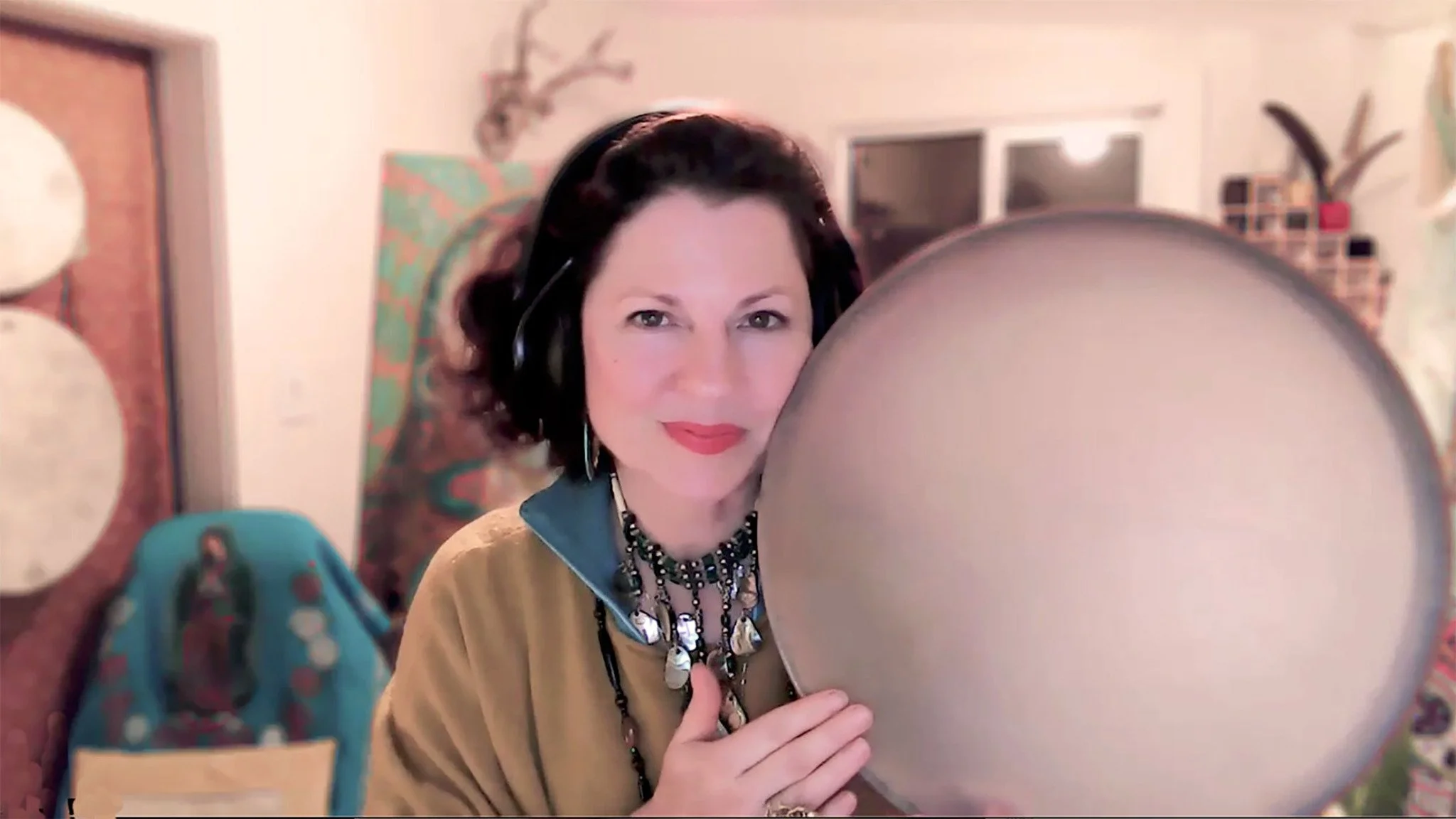 Lavender Grace Kent with a frame drum, inviting a personal connection to rhythm and song.