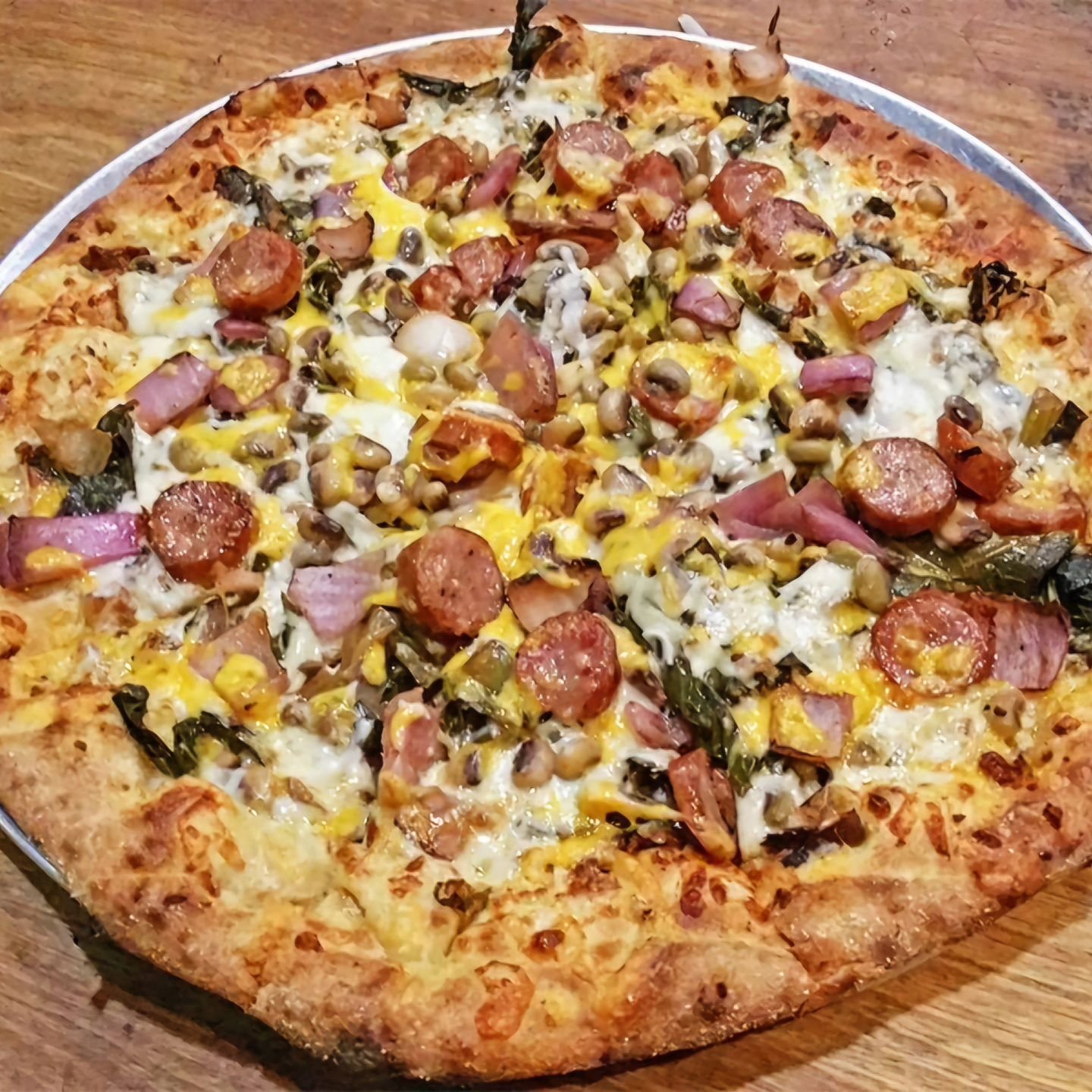 If you're craving leftovers from Thanksgiving, but tired of being at home, then there's no other choice than to order our infamous Soul Pie! 🍕🦃

It's basically our version of Thanksgiving, but on a pizza! Turnip greens, black-eyed peas, bacon, cone