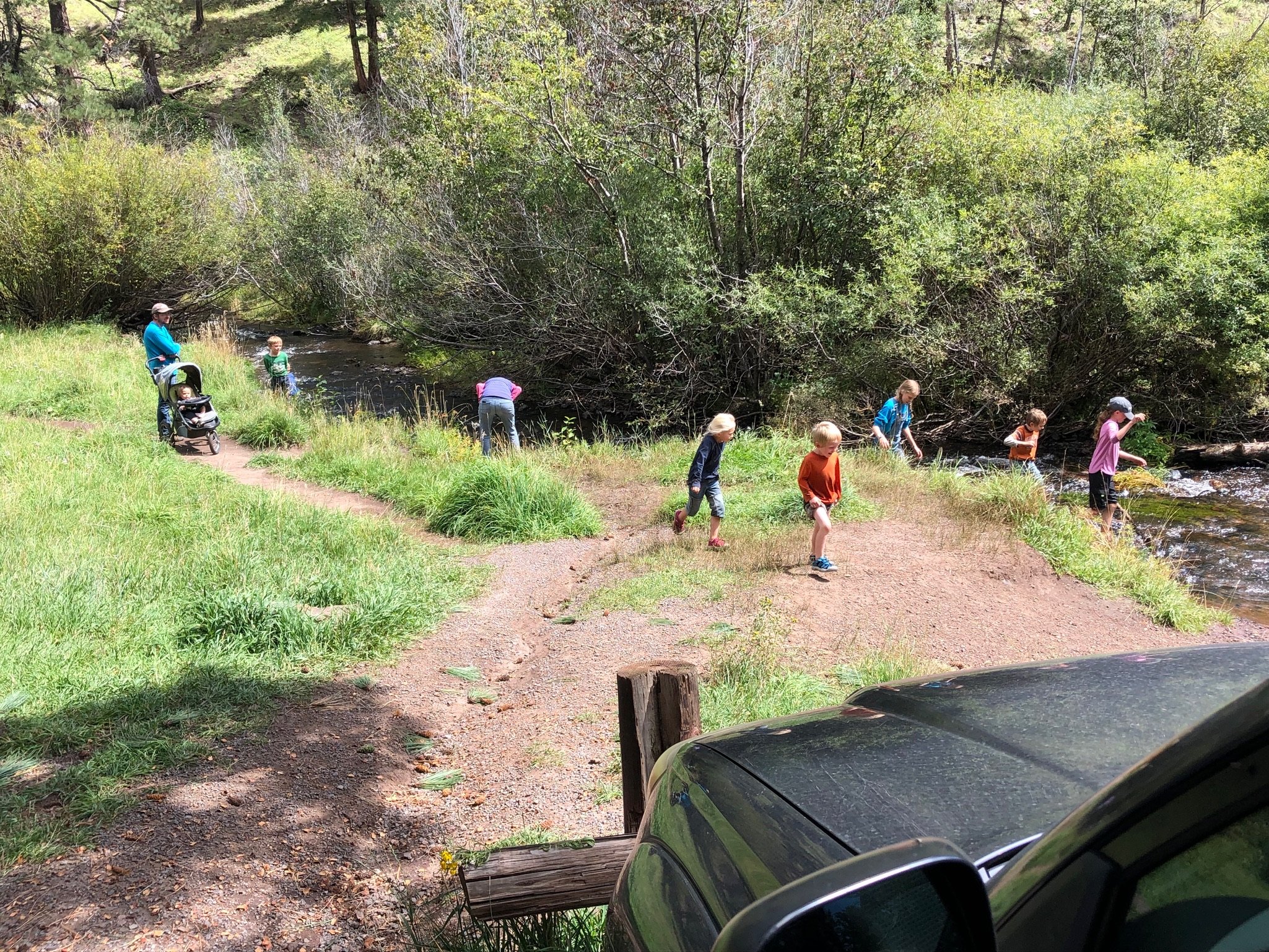 Loren noticed a group of kids near where I didn't want to cross the water. He asked them if they wanted to try the project of helping me decide cross the river.