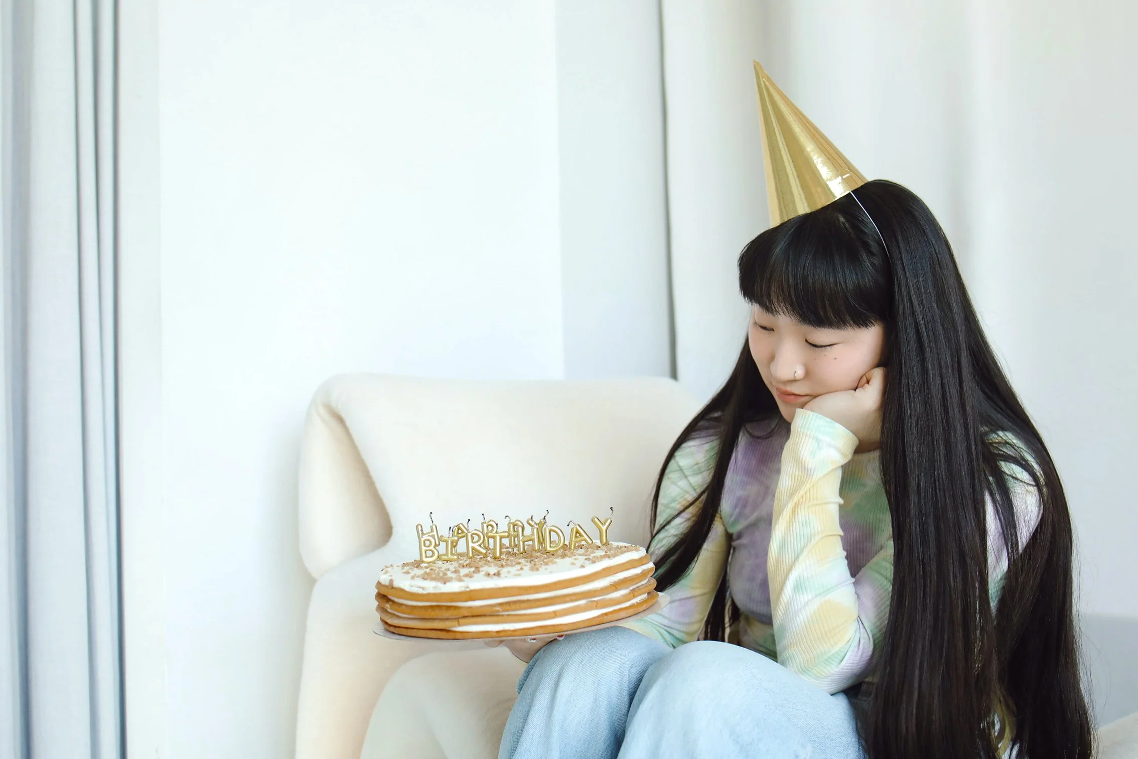 sad girl with birthday cake