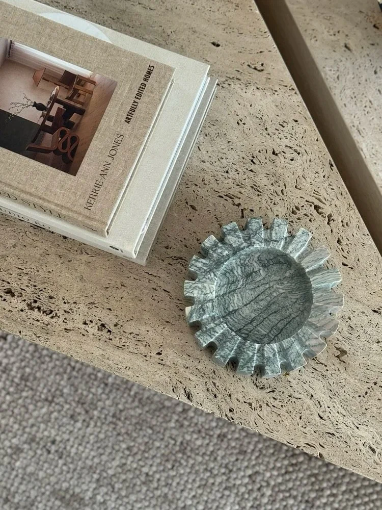A quiet detail, but never an afterthought.

The AJ Ashtray in Cippolino adds natural texture and sculptural form to this layered coffee table moment

With its soft green-grey marble and distinctive veining, it feels both functional and decorative. Th
