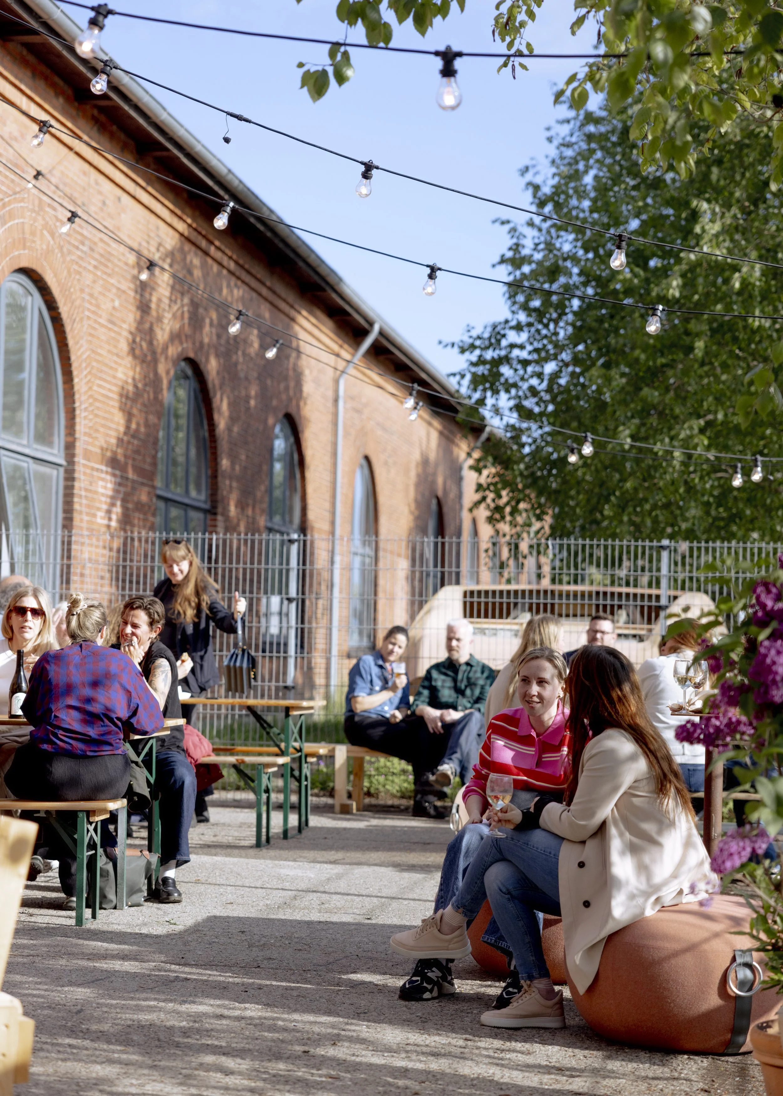 People sitting outside in a courtyard