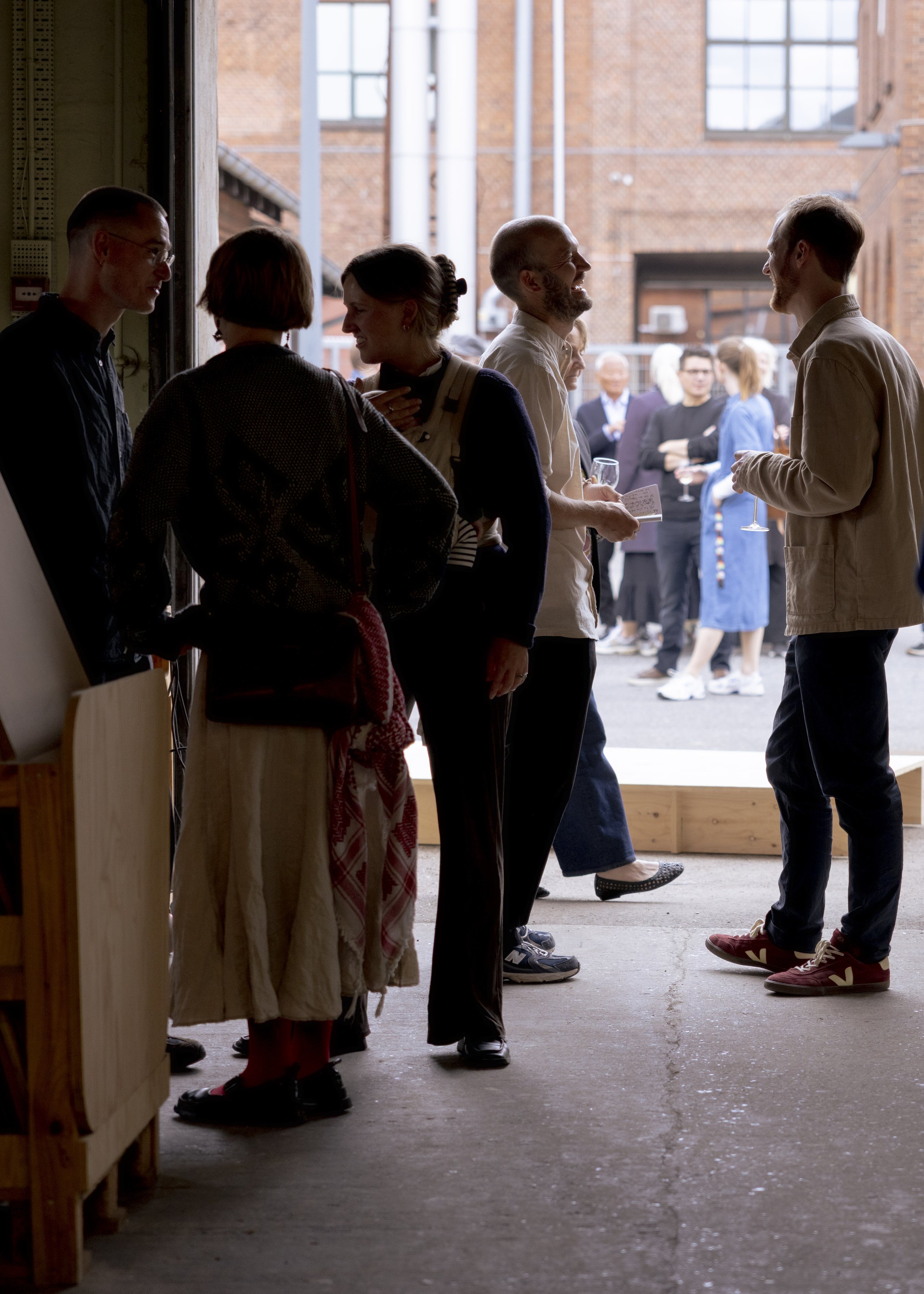 People talking in a doorway
