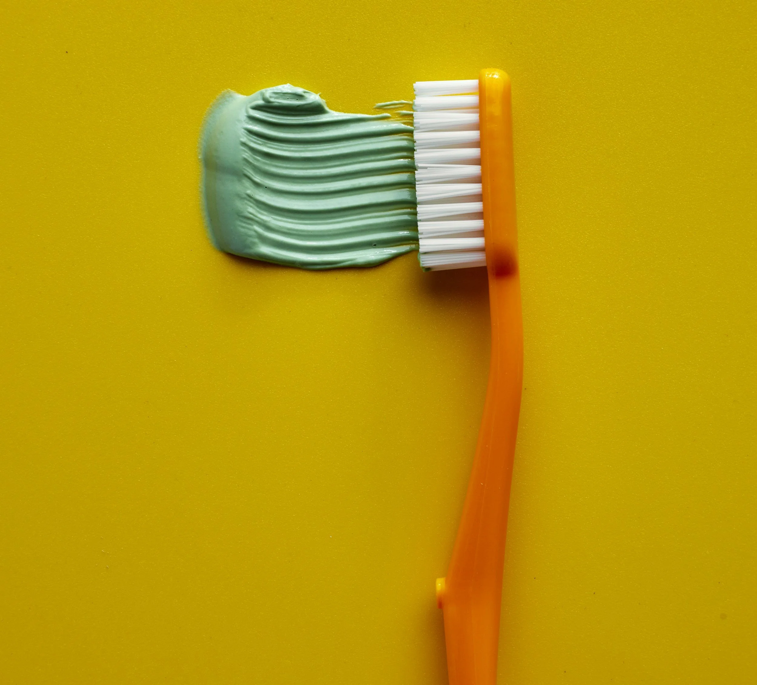 Why do some people build up plaque and tartar more quickly than others?