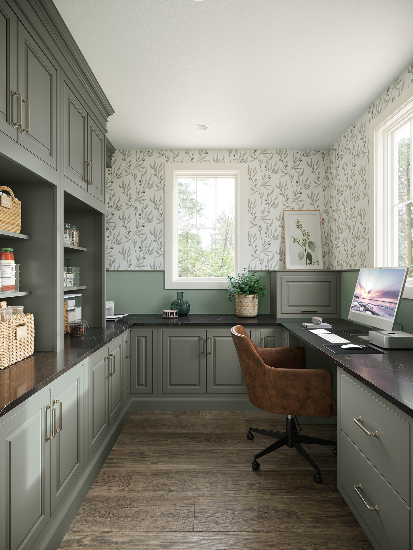 Home office with green cabinets, wood flooring, and a window. A computer and brown swivel chair are at the desk, surrounded by decorative items and plants.