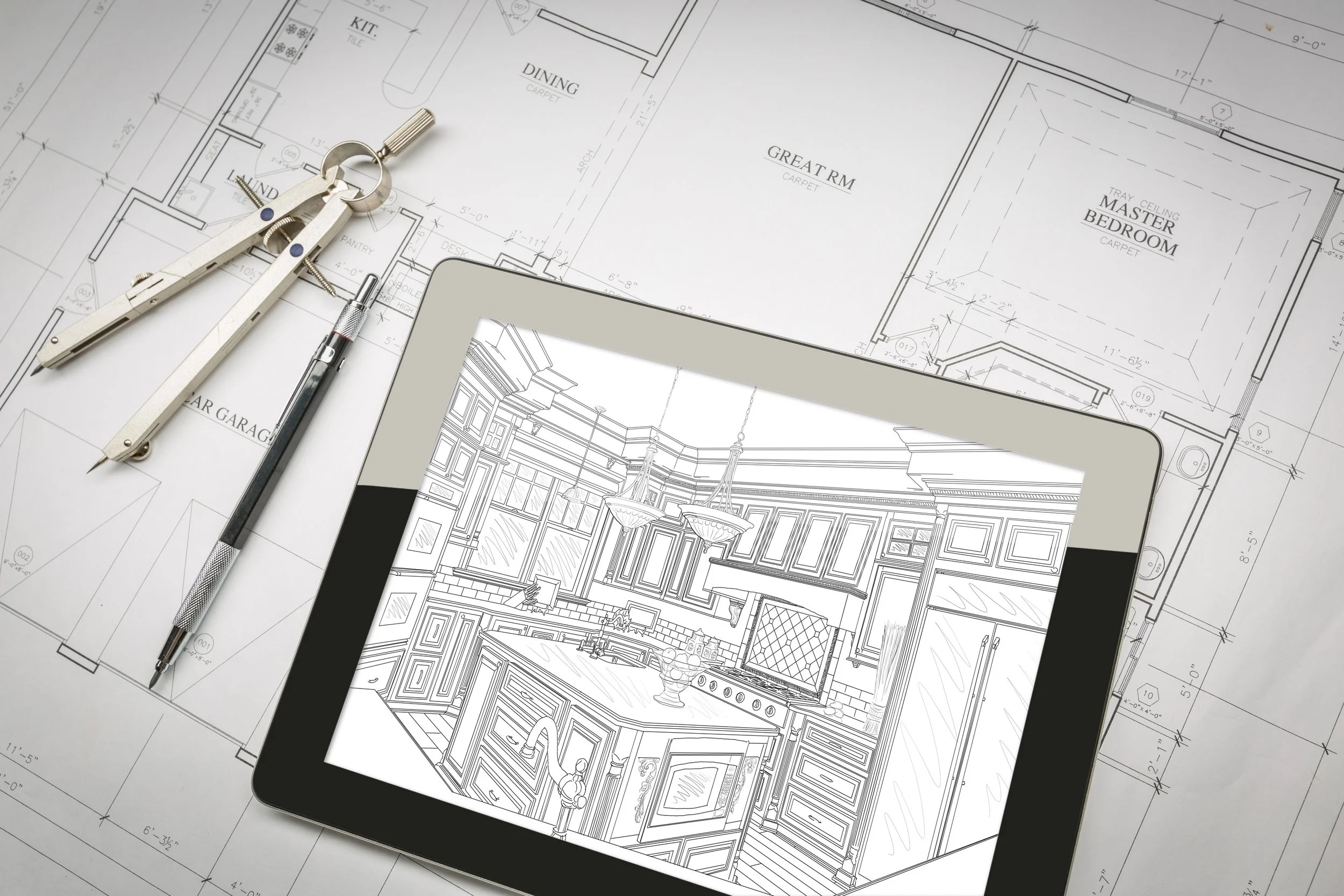 Architectural blueprints with a digital tablet displaying a kitchen drawing, a pencil, and a compass placed on top.