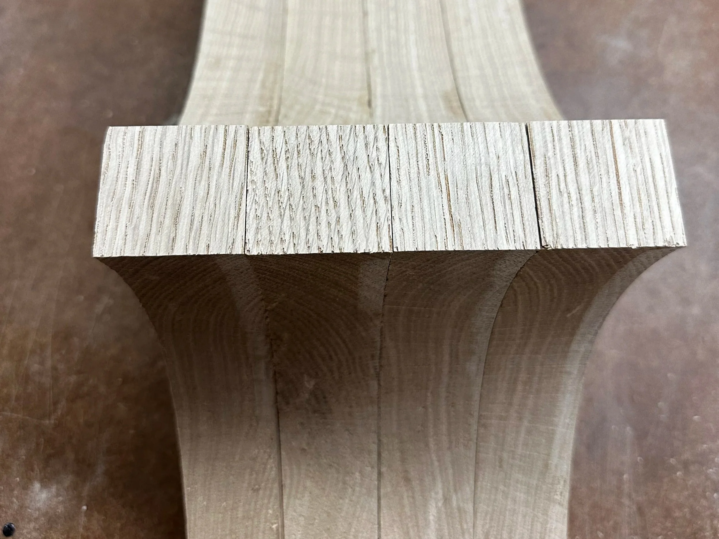 Festool Domino mortise slots cut into white oak table leg showing clean joint walls