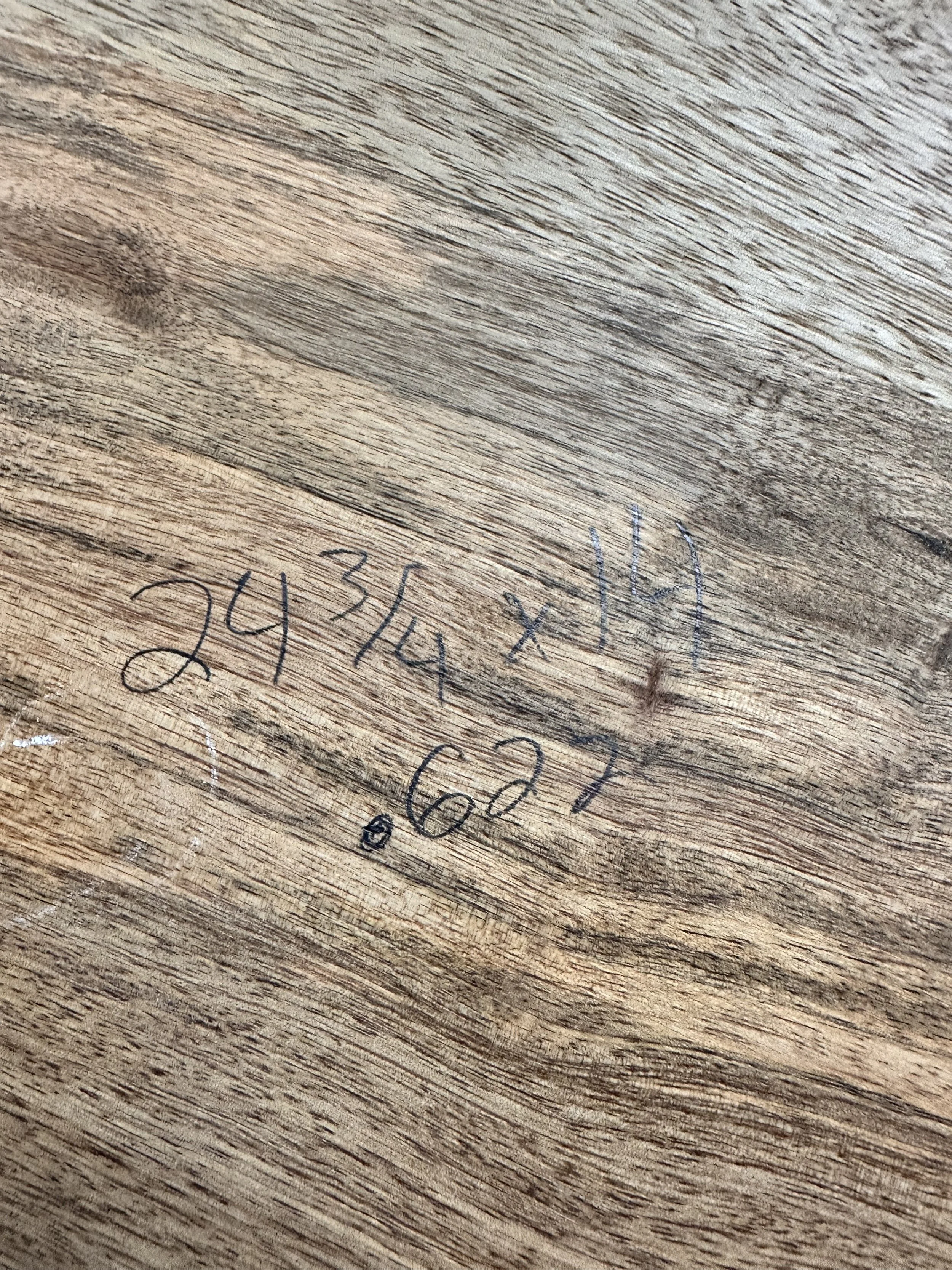 Raw walnut board with pencil marks ready for grain matching on project