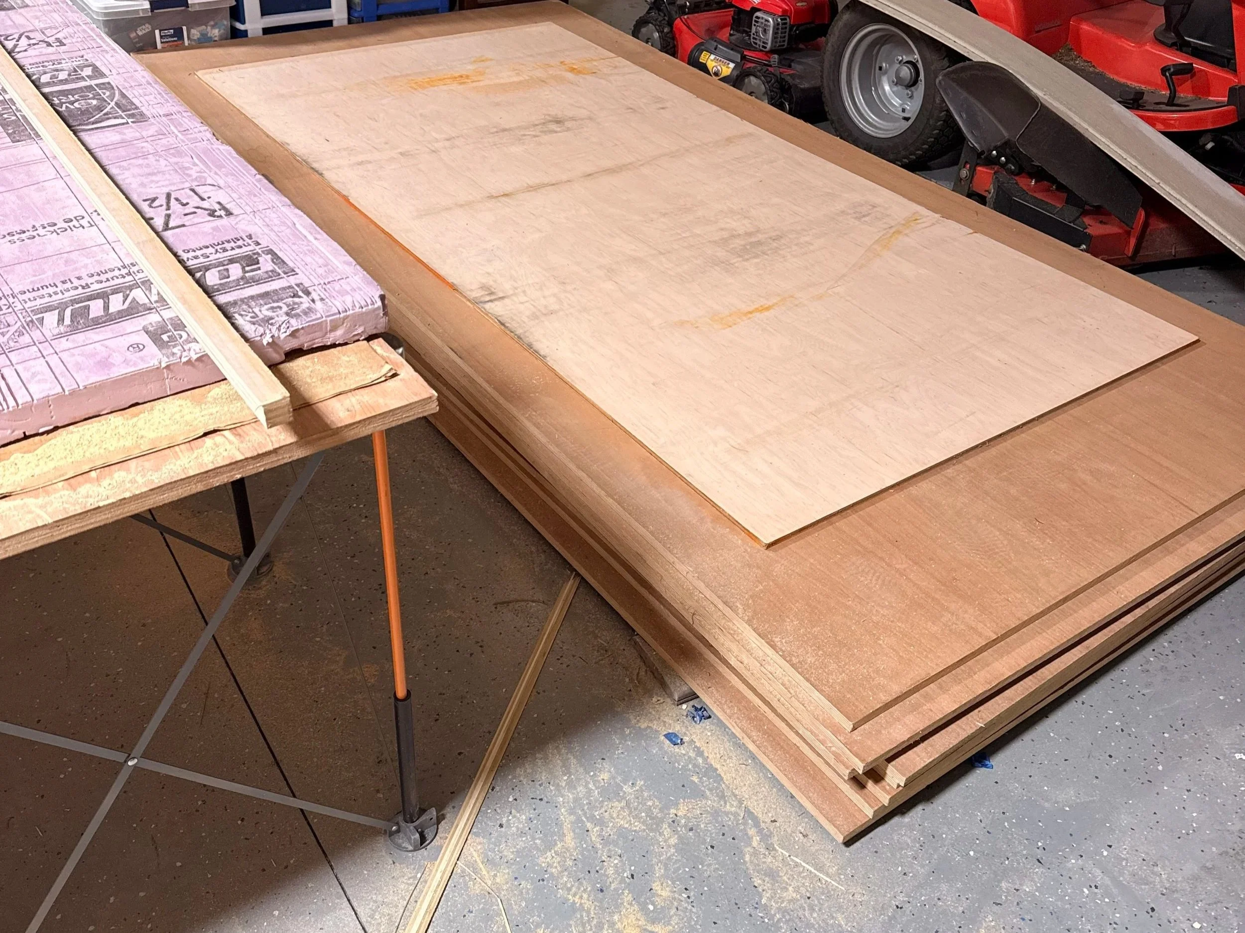 Full sheet of rift sawn white oak plywood on the Bora Centipede workstation in the garage ready for track saw breakdown