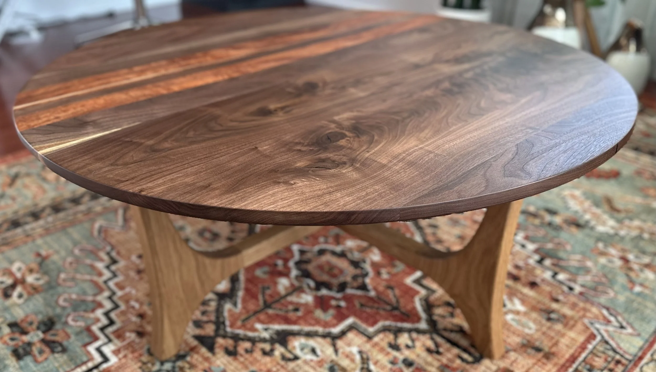 Walnut with beautiful grain patterns used in a coffee table with a white oak base