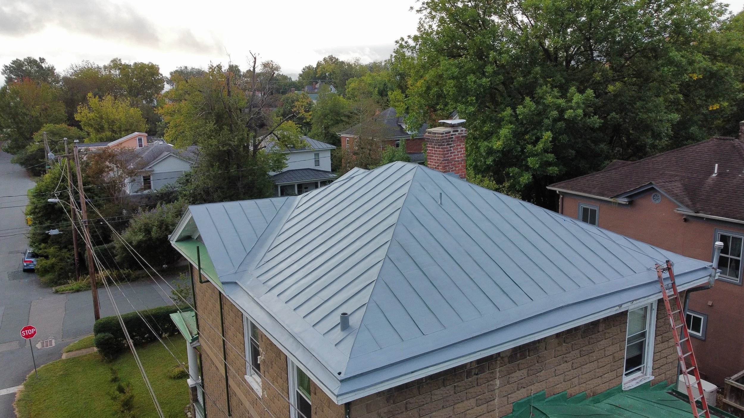 Metal roof painting primer in 10th &amp; Page neighborhood in Charlottesville