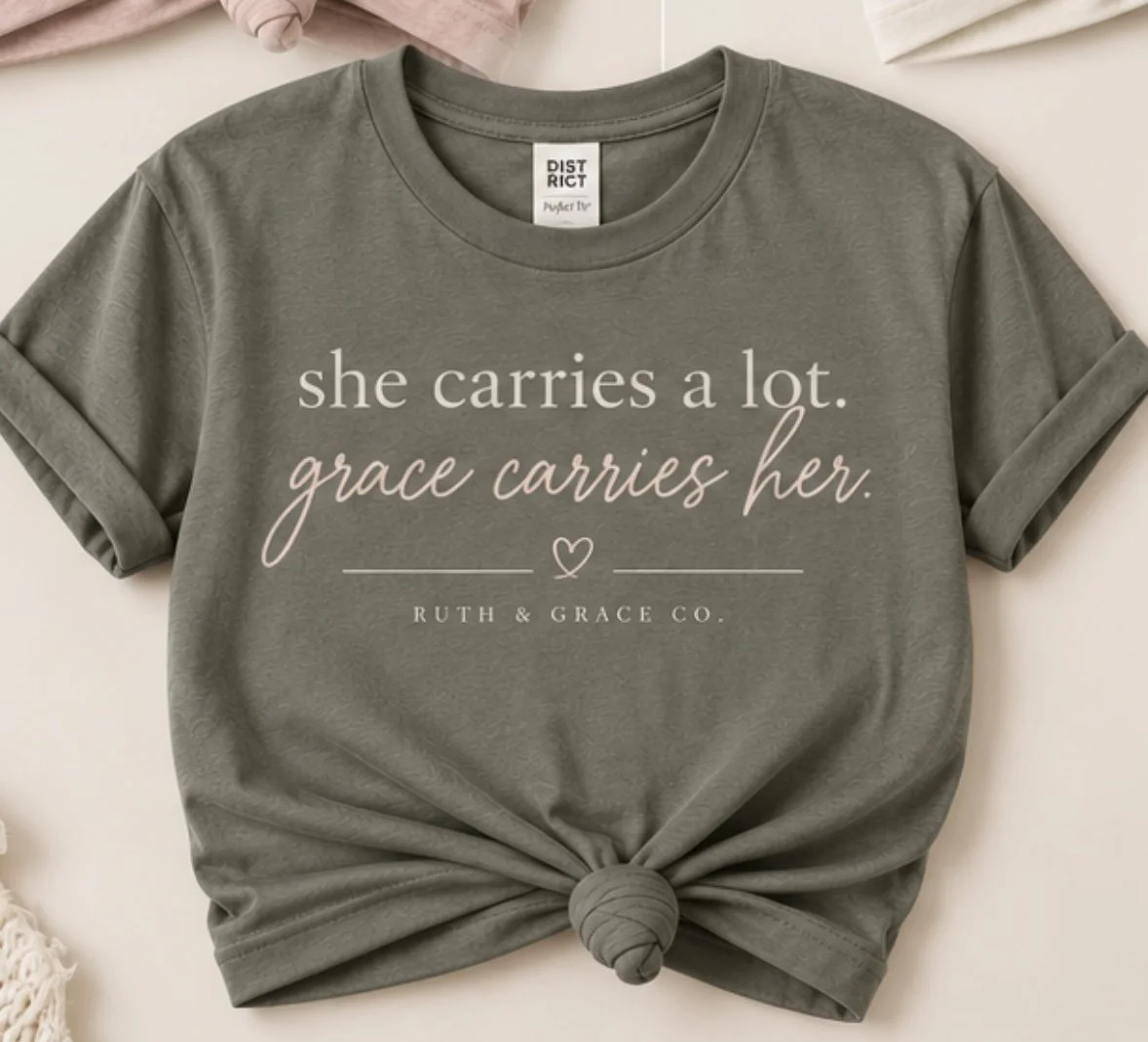 She Carries a Lot, Grace Carries Her Tee